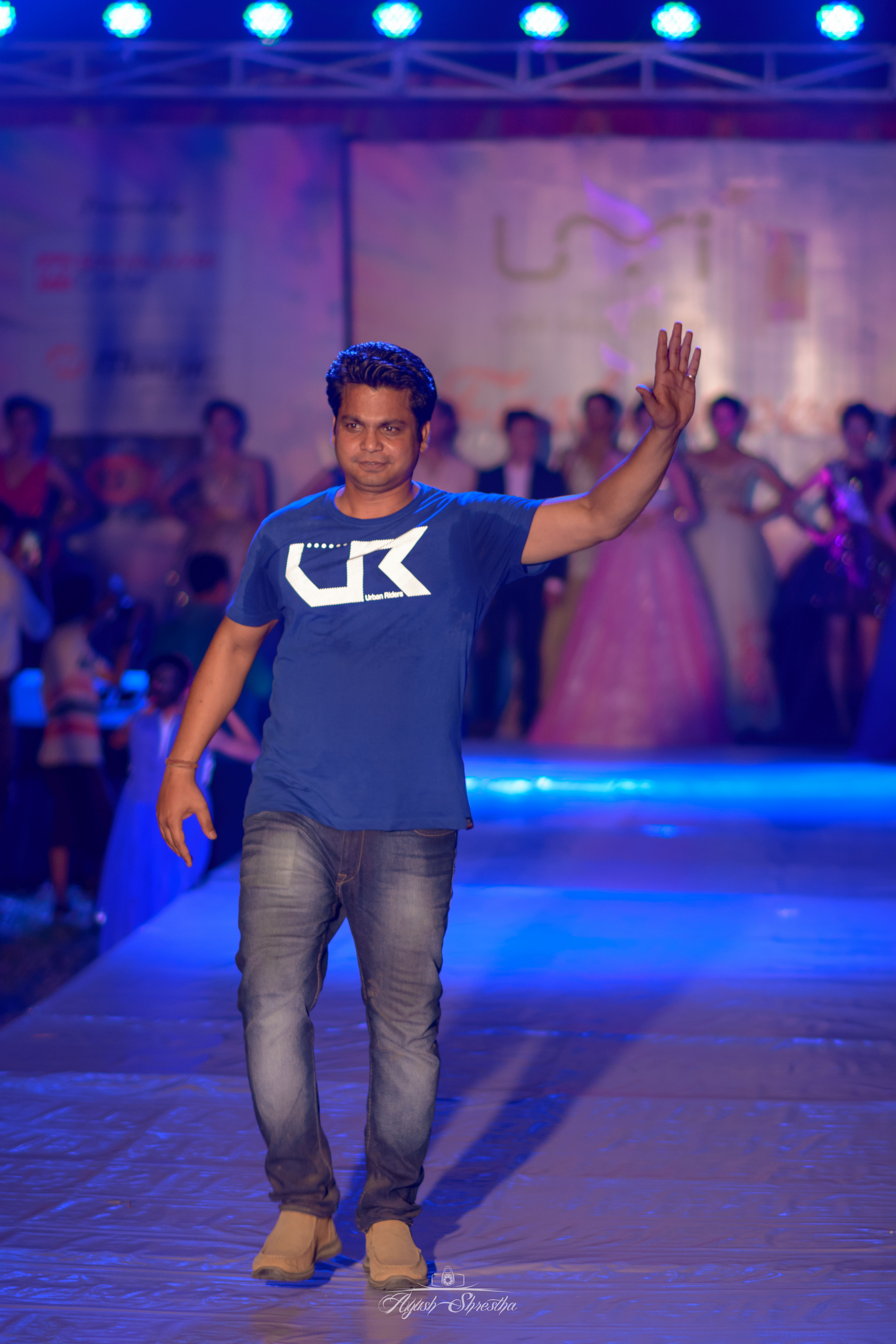 Event Manager Rikesh Karna on stage.