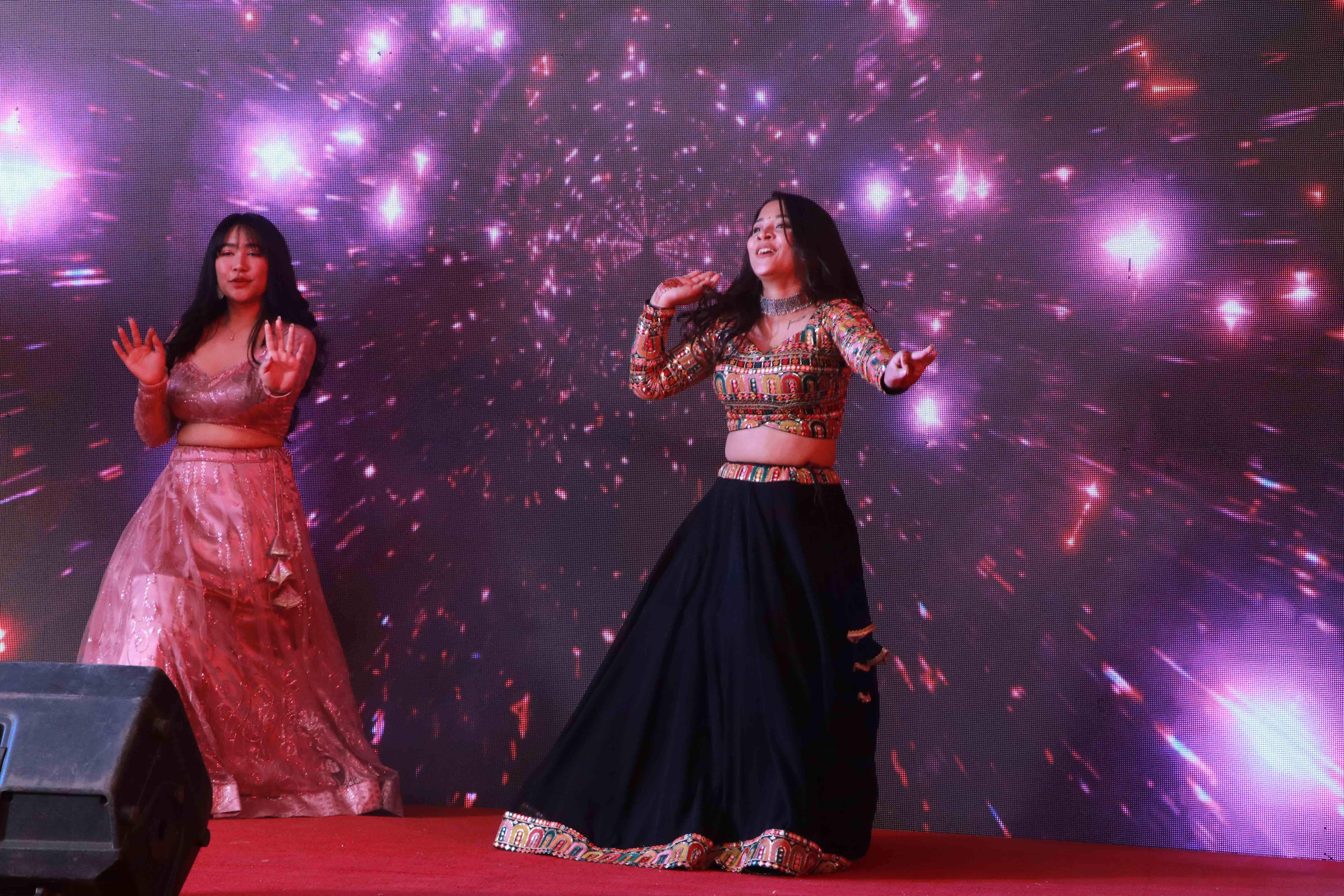 Family members performing a dance on stage