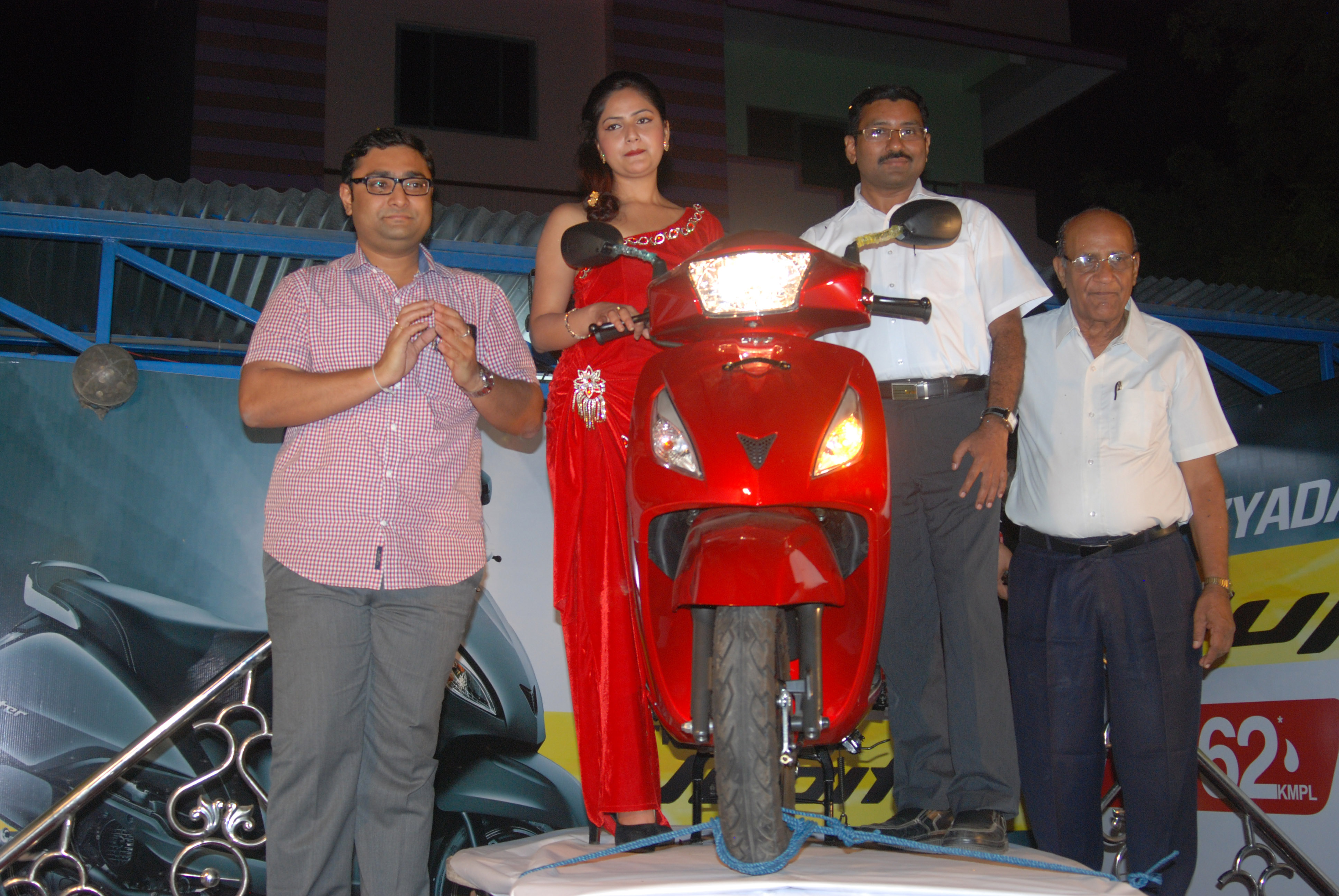 Actress Barsha Siwakoti and the Mahabir Automobiles team with the scooter.