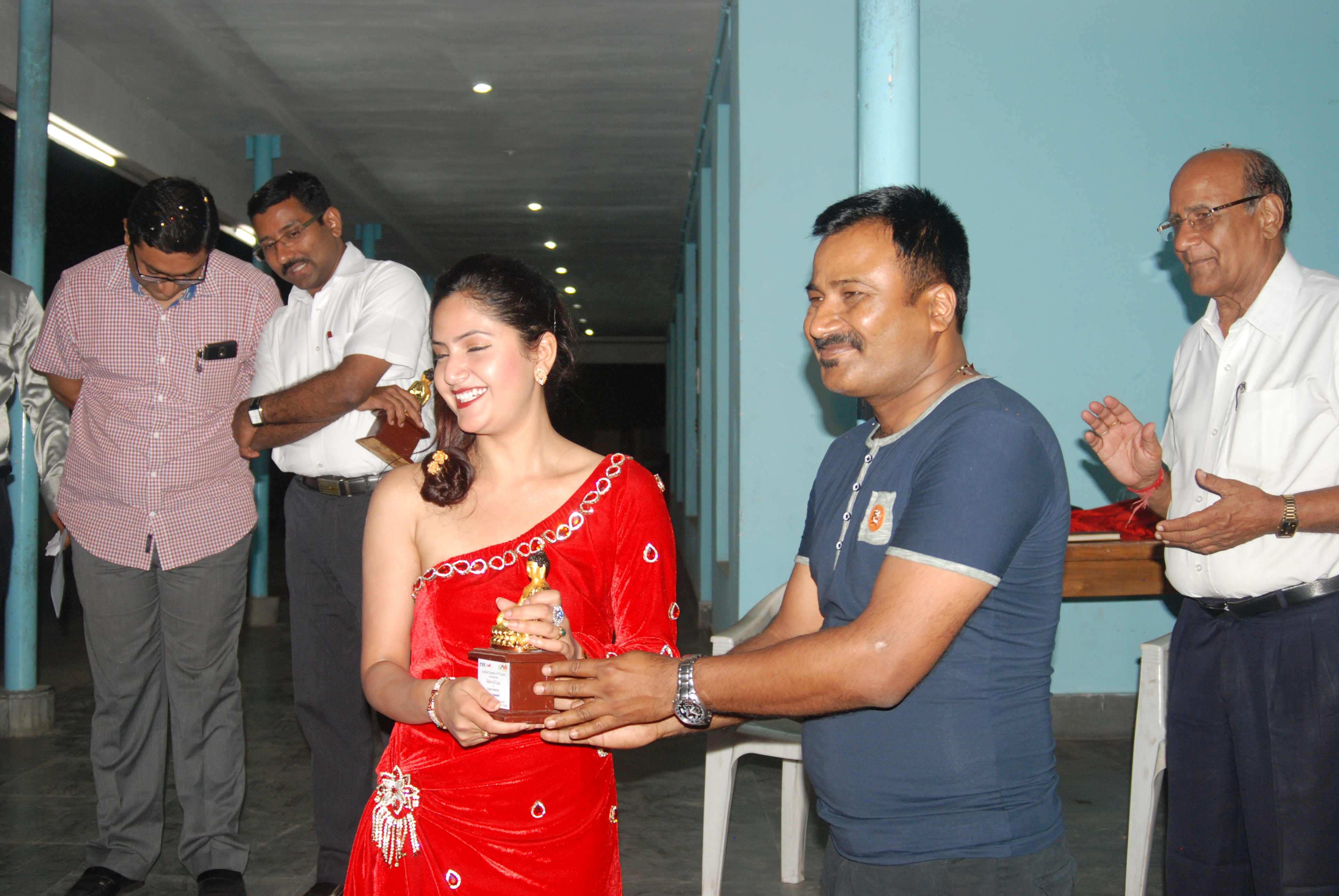Barsha Siwakoti receiving a token of love from Om Sharma.