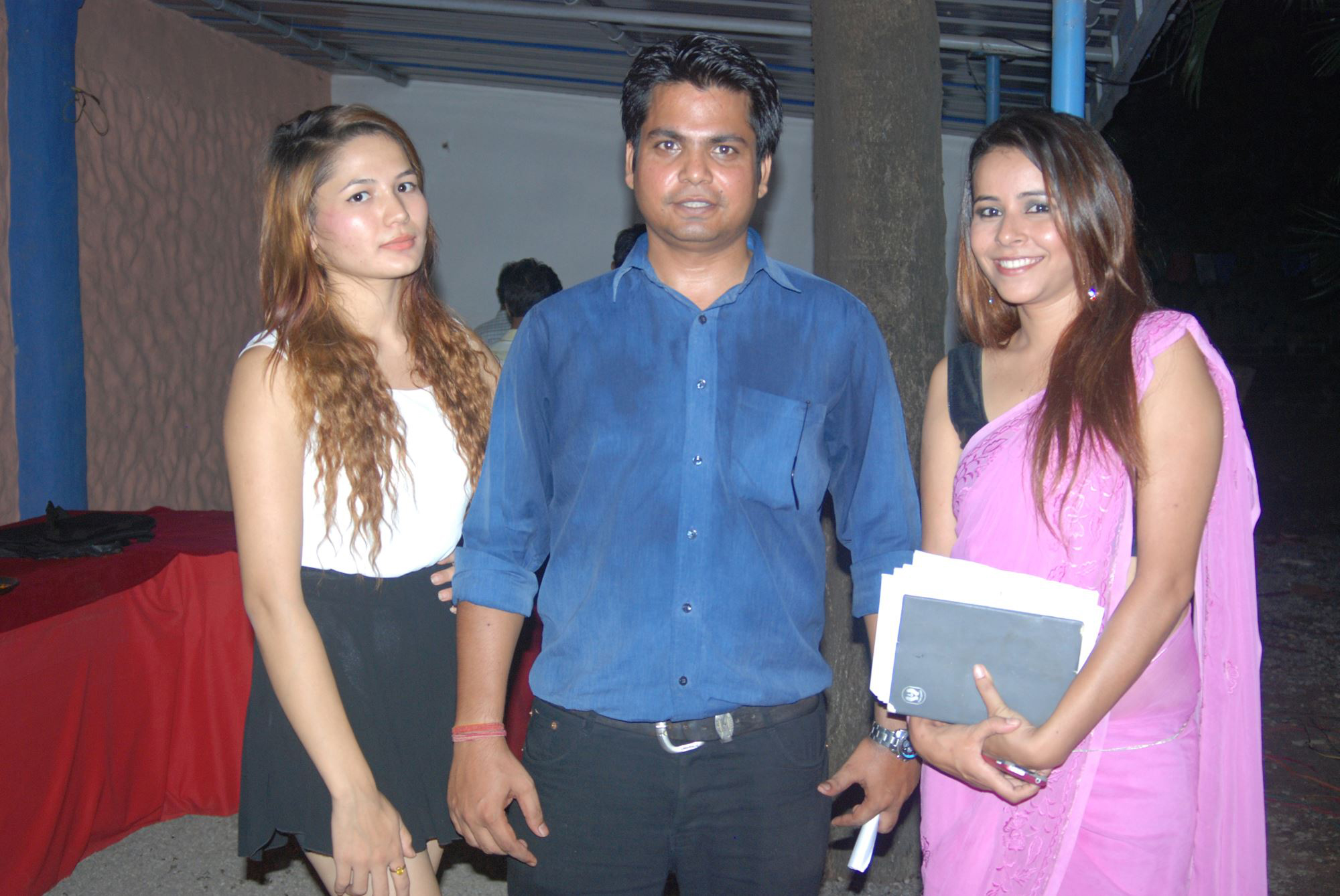Event Manager Rikesh Karna with ushers and MC Deepika Shrestha.
