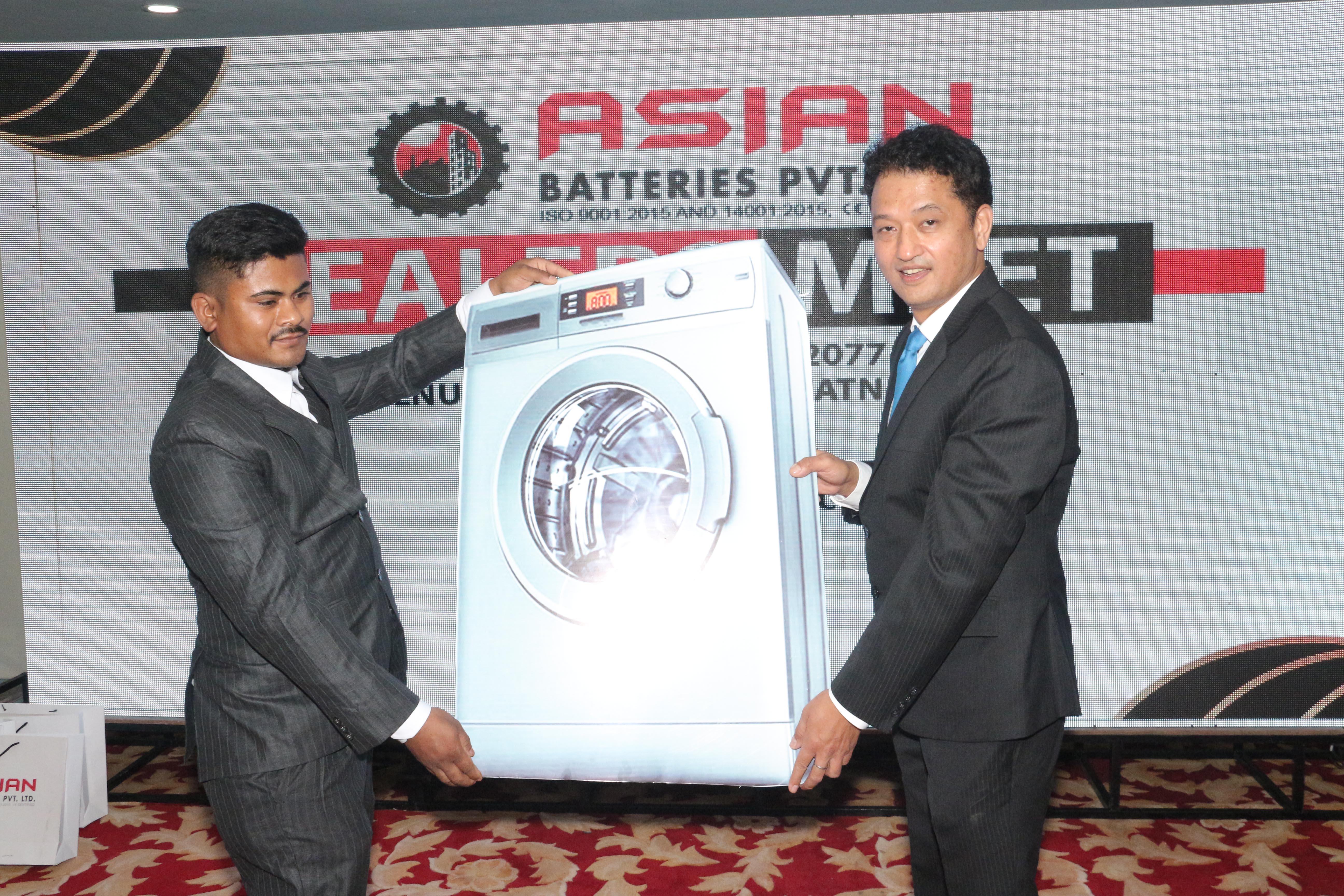 Prize distribution to dealers for meeting their sales targets.