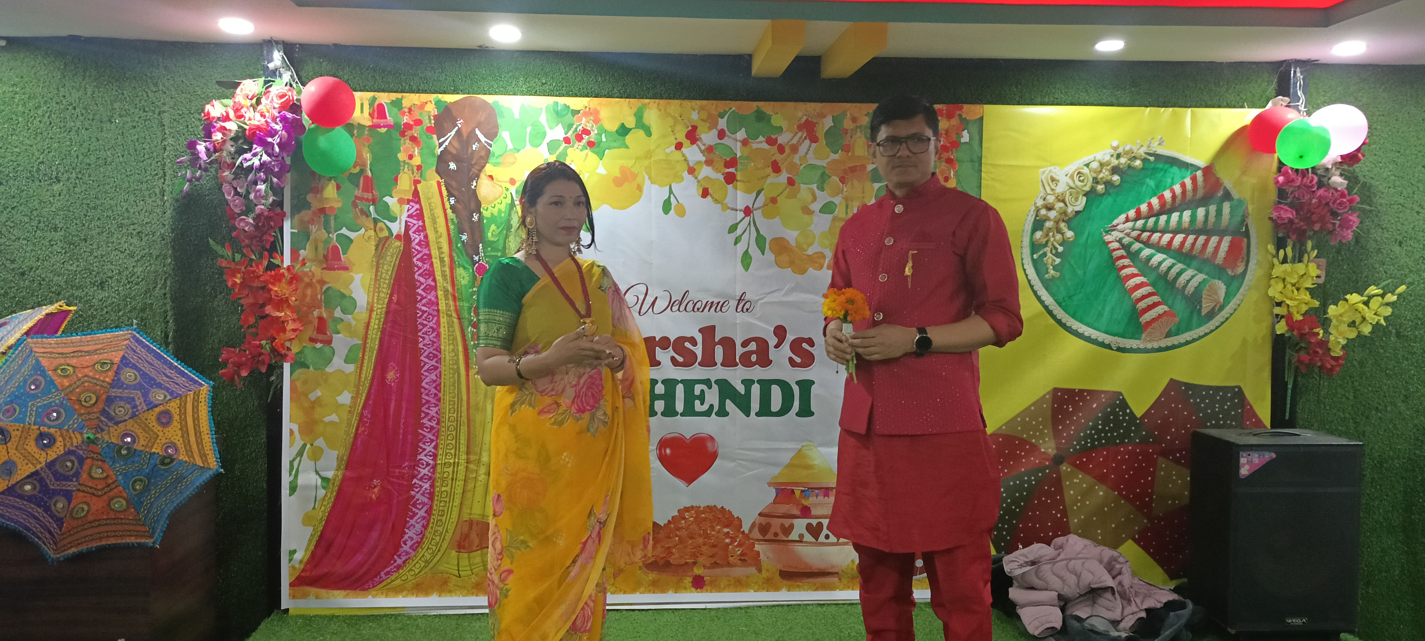 The happy bride and groom posing on the stage.