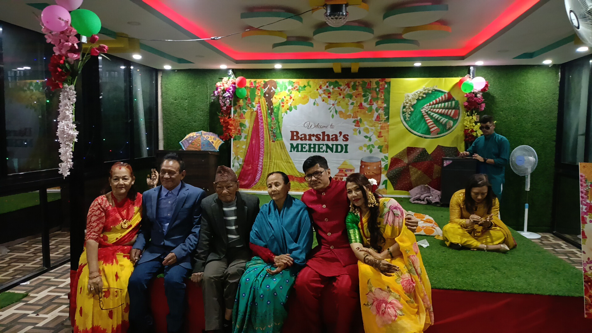 Family members posing for a photo on the stage.