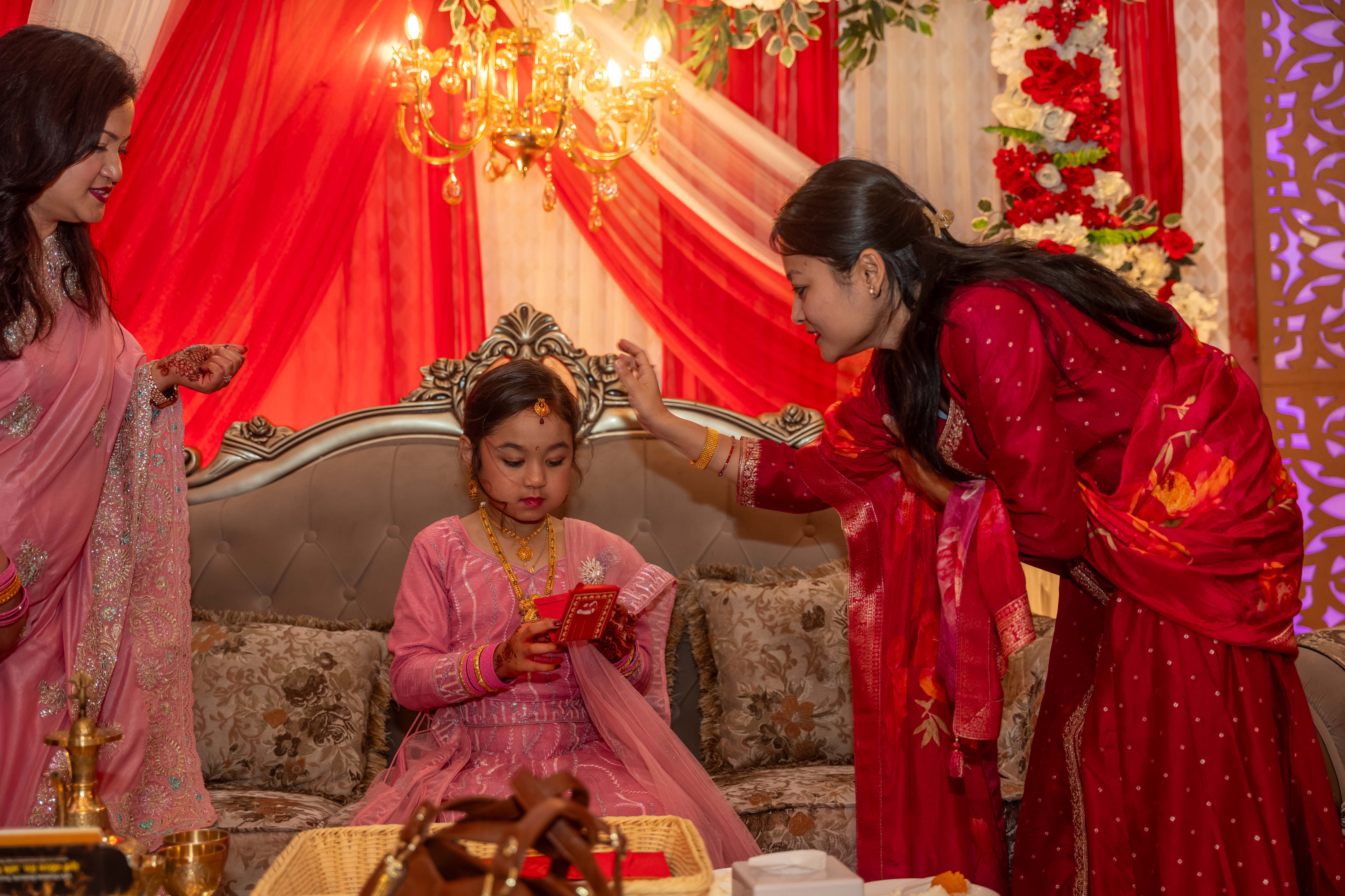 The bride receiving gifts from guests.