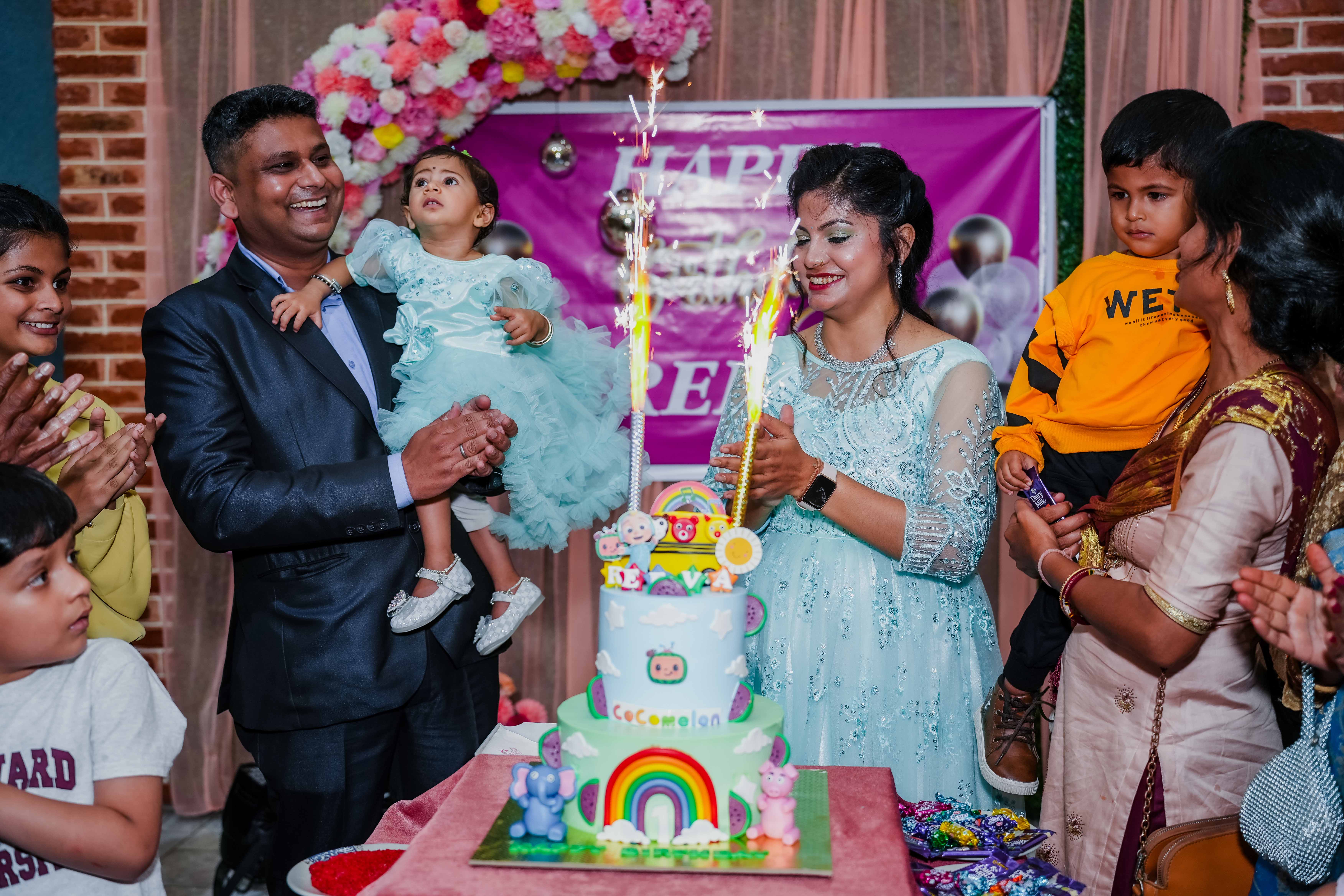 Lighting the candle on the cake for the birthday ceremony.