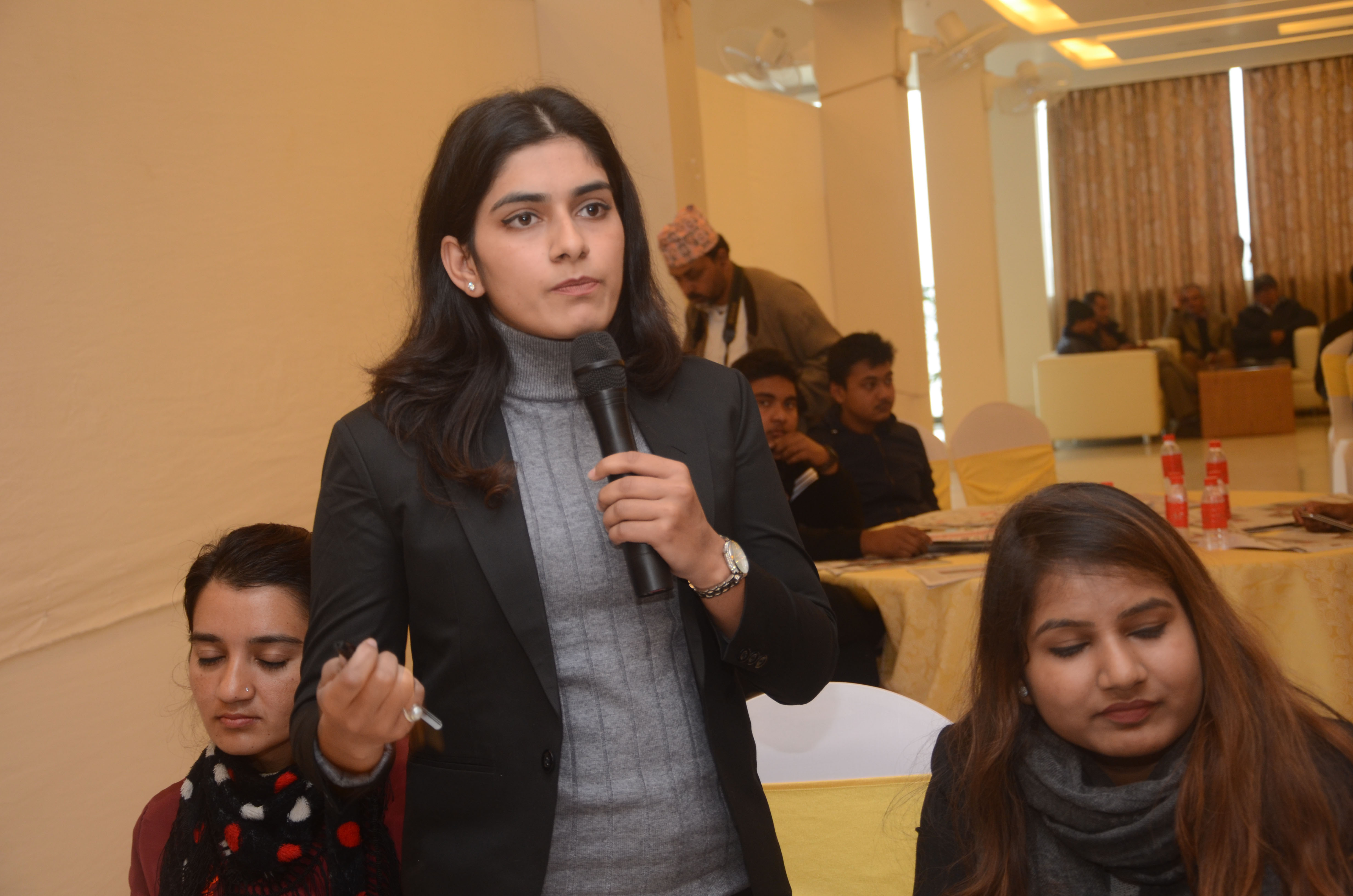 A young attendee asking a question.