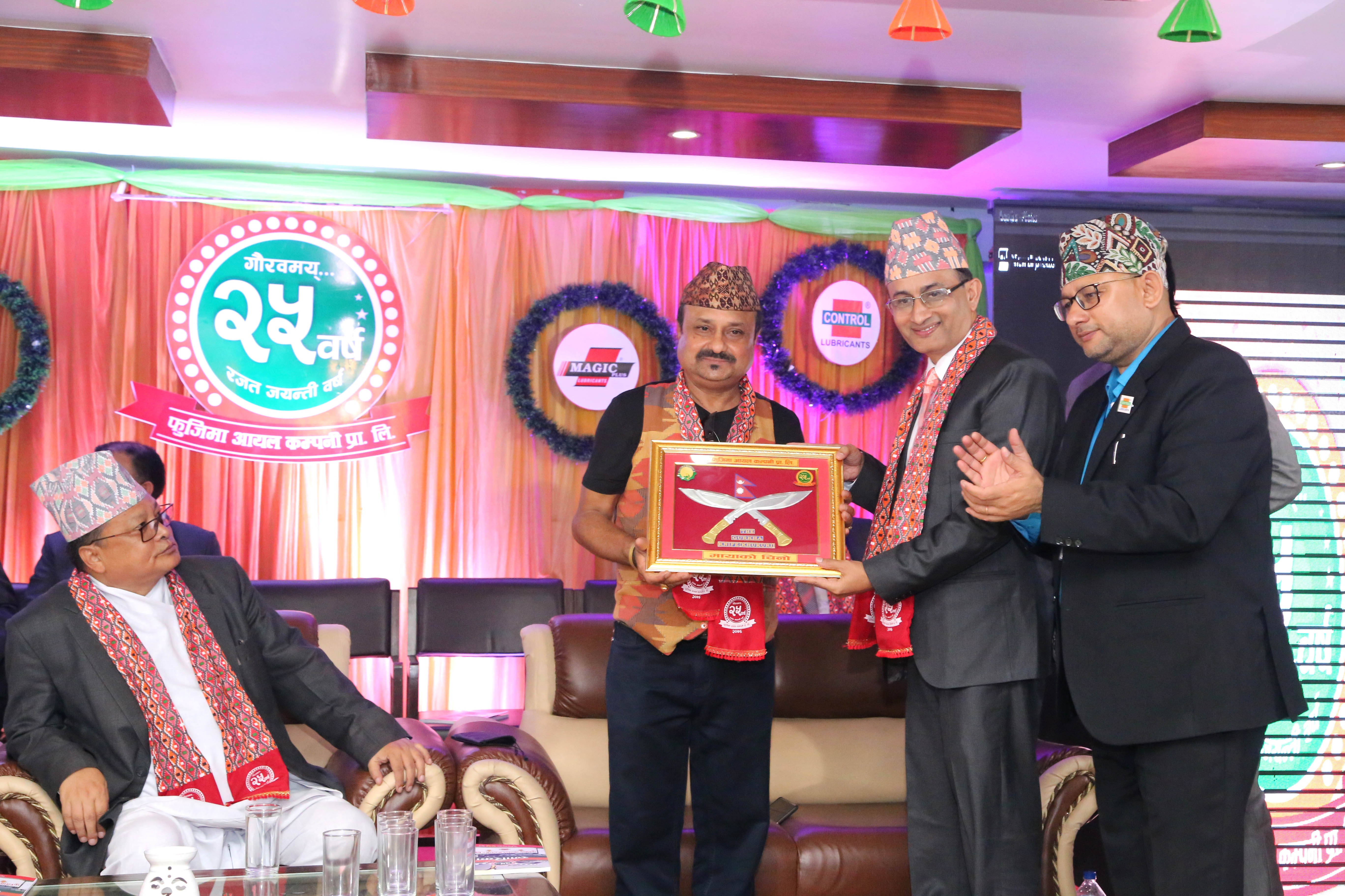 Subodh Koirala, Managing Director of Fujima Oil Company, giving a token of love to Shivahari Paudyal.