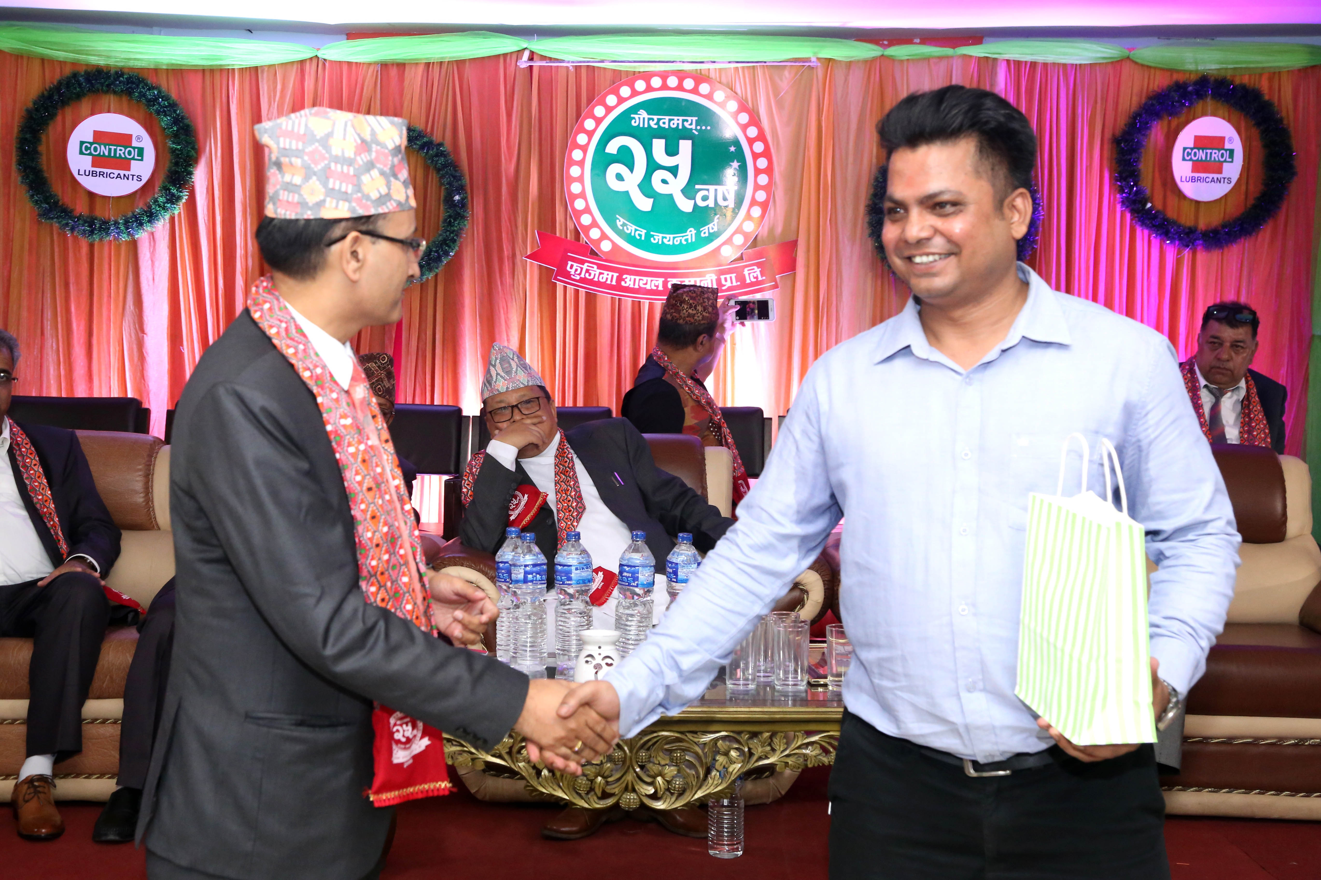 Subodh Koirala, MD of Fujima Group, giving a token of love to Rikesh Karna, the Event Manager.