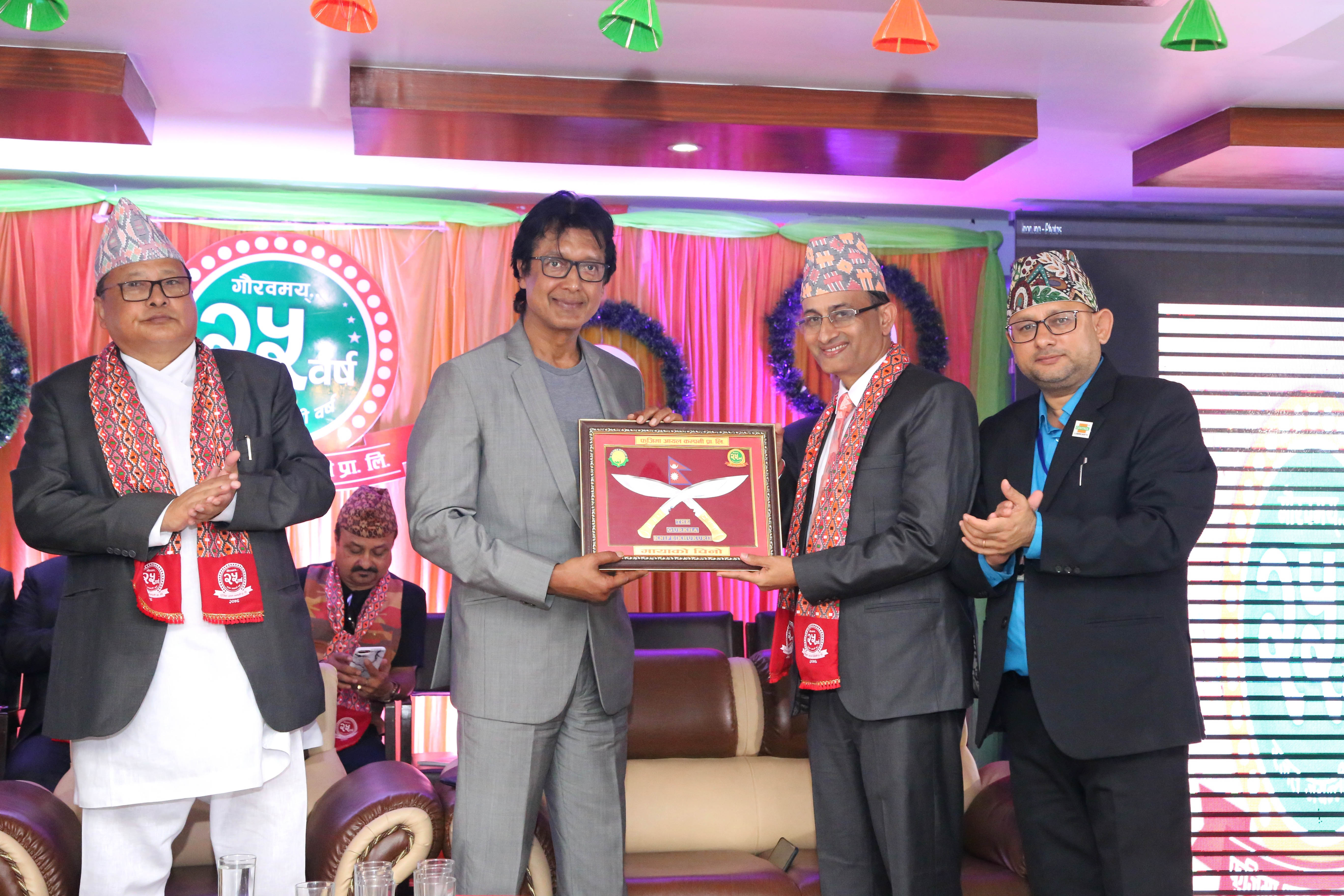 Subodh Koirala, MD of Fujima Oil Company, giving a token of love to Rajesh Hamal, Royal Lubricants Brand Ambassador.