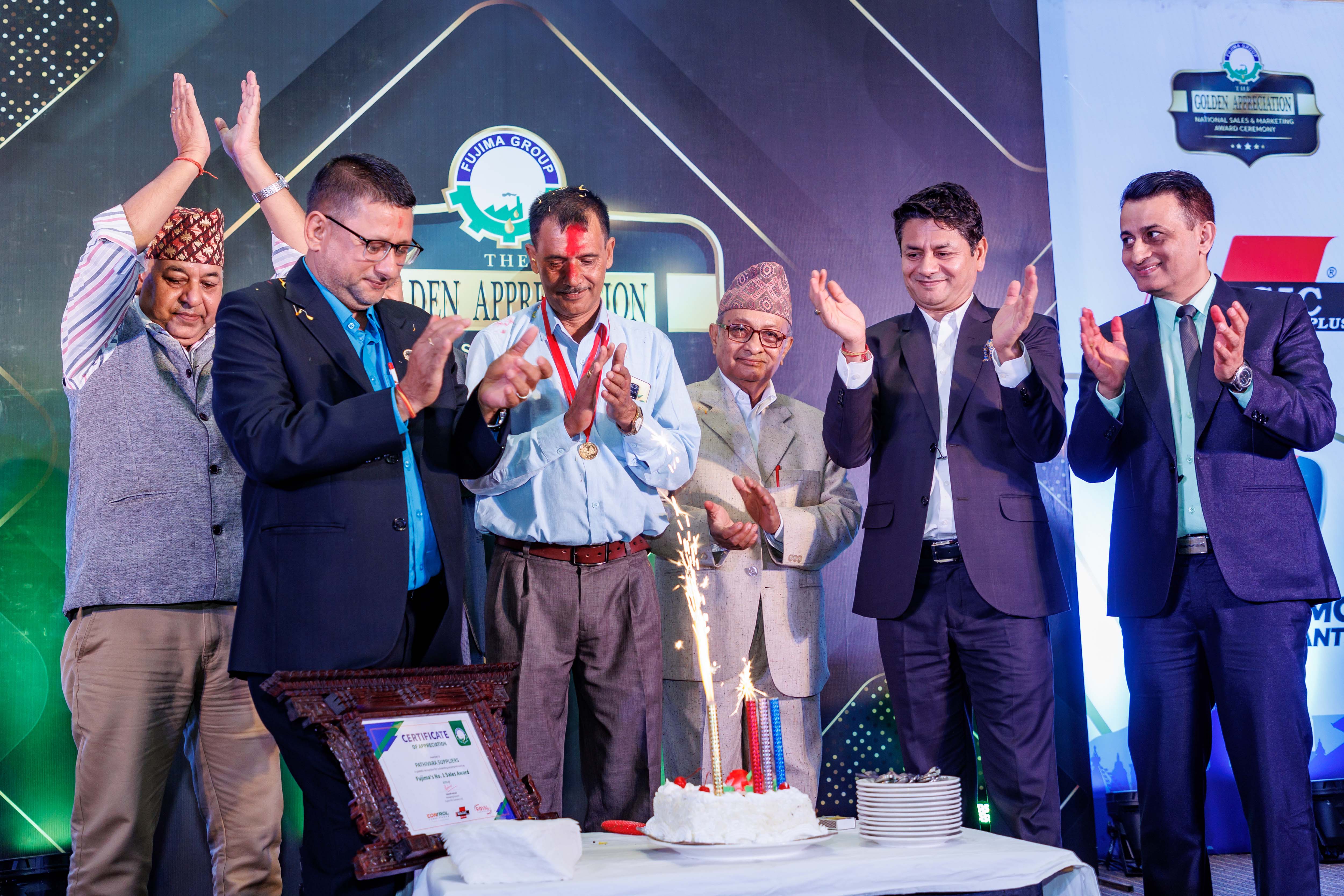 Company management team celebrating the number one distributor.