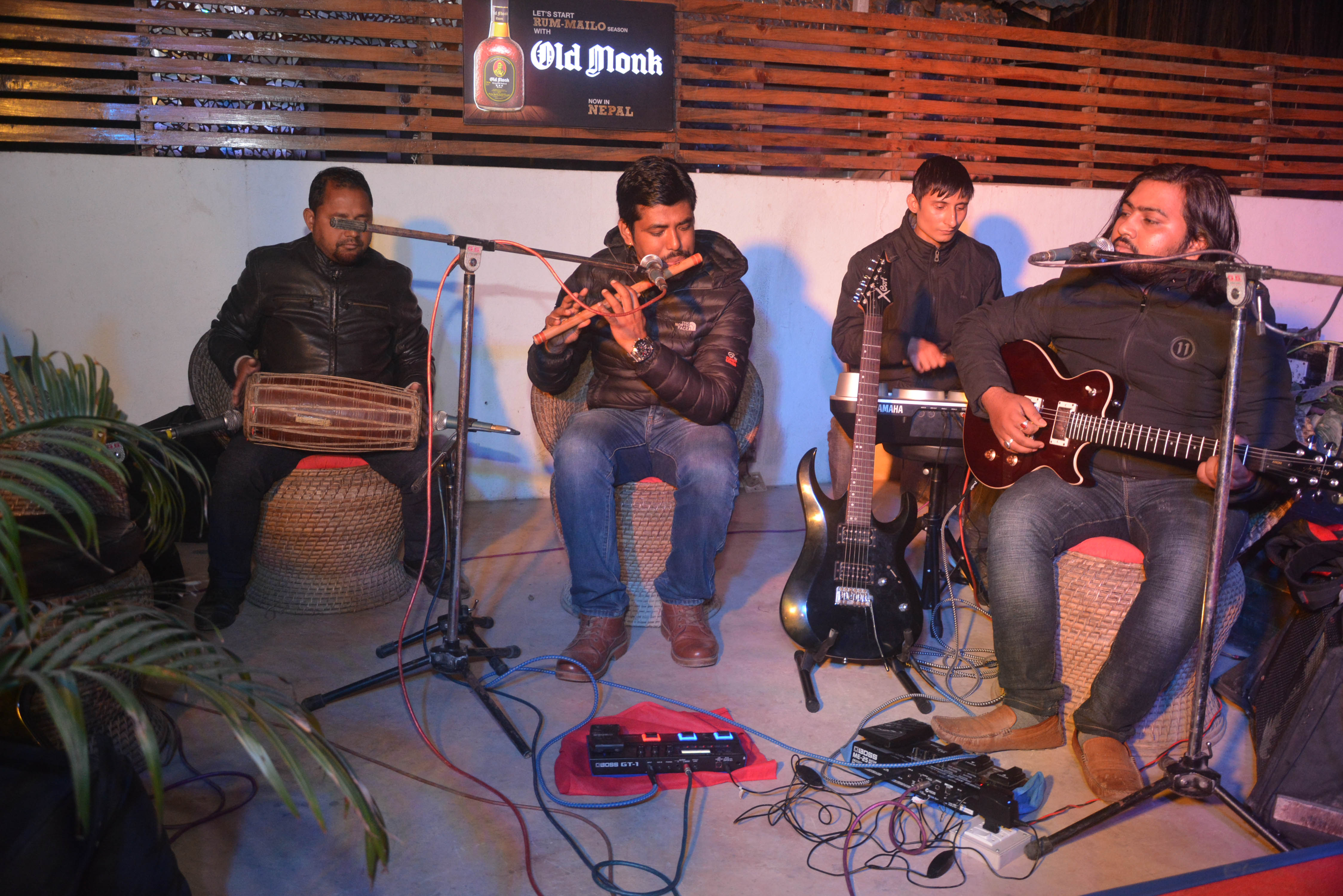 Singers entertaining guests by playing flutes.
