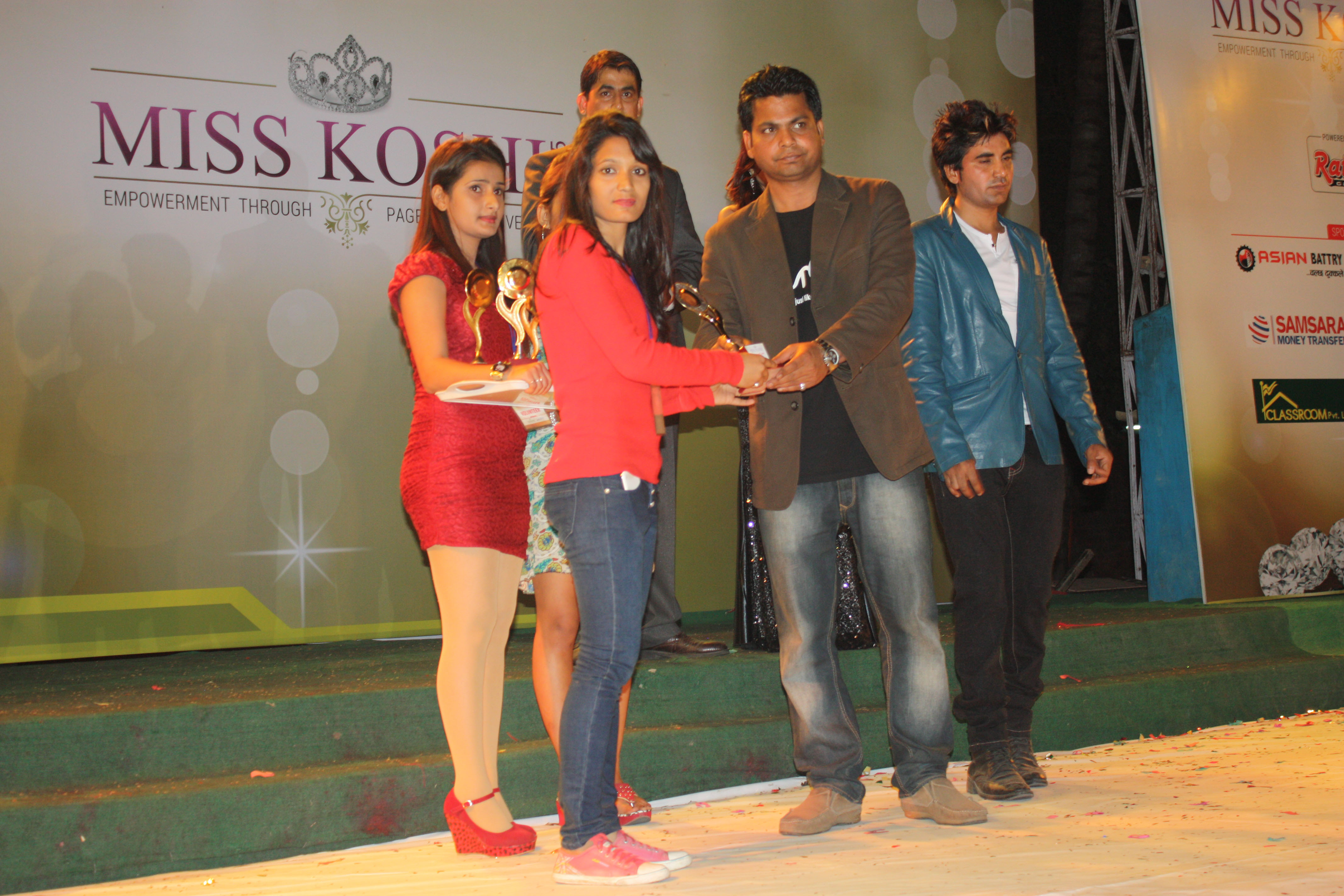 Event manager distributing a token of love to a sponsor.