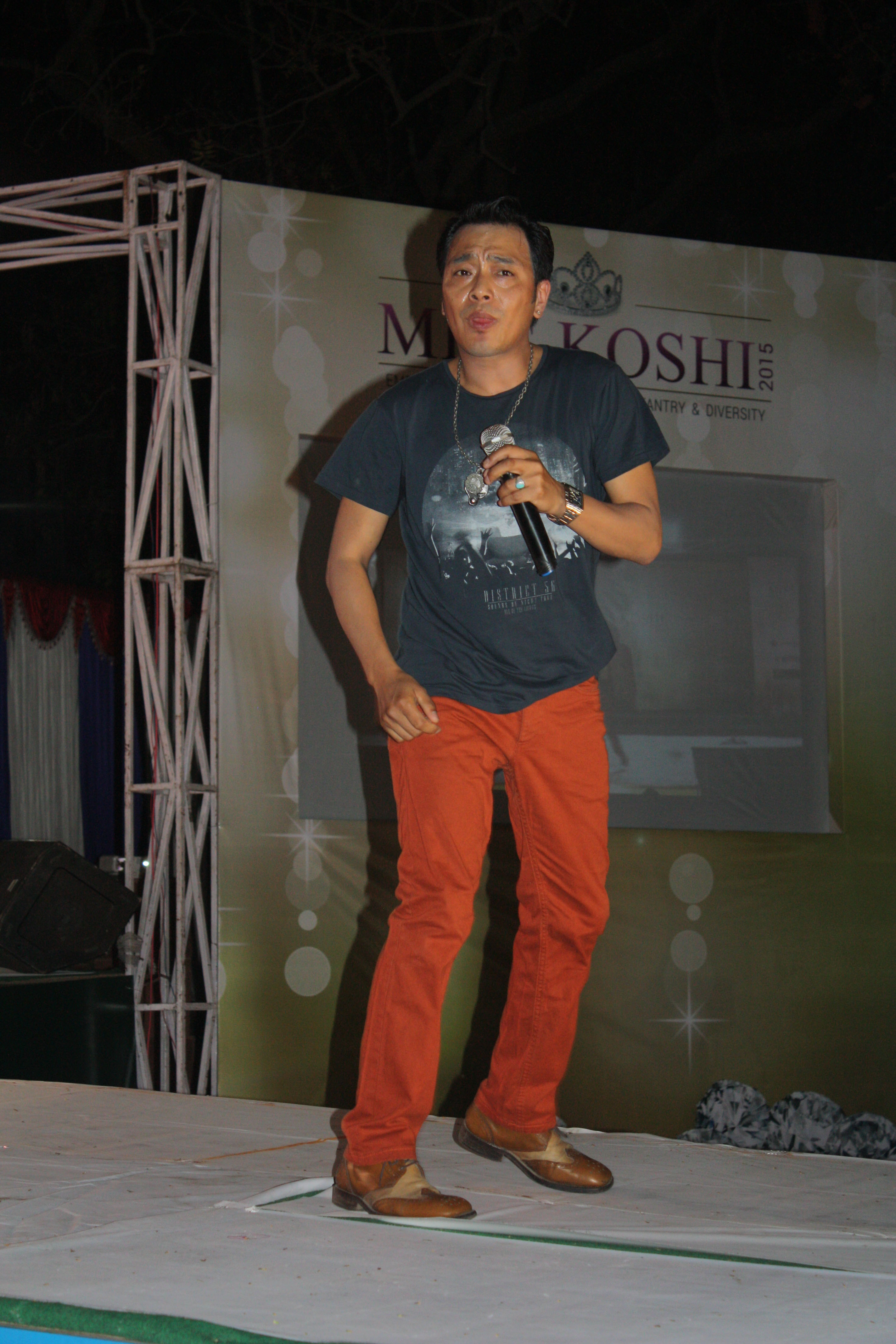 Singer Nima Rumba performing on stage.