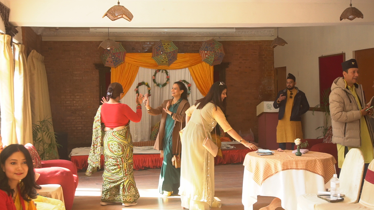 Guests enjoying the festive atmosphere of the Mehendi ceremony.