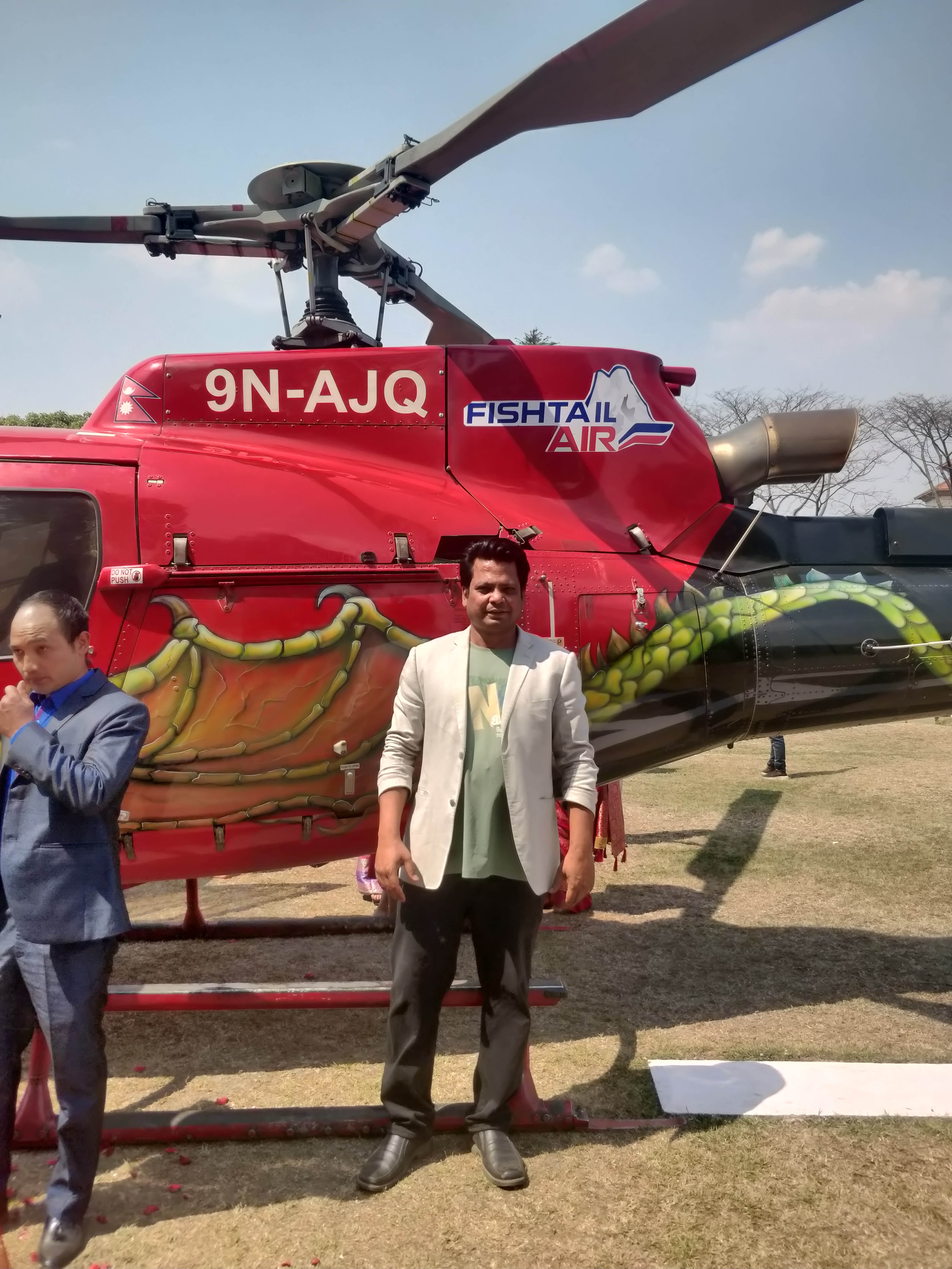 Event Manager Rikesh Karna coordinating the helicopter arrival.