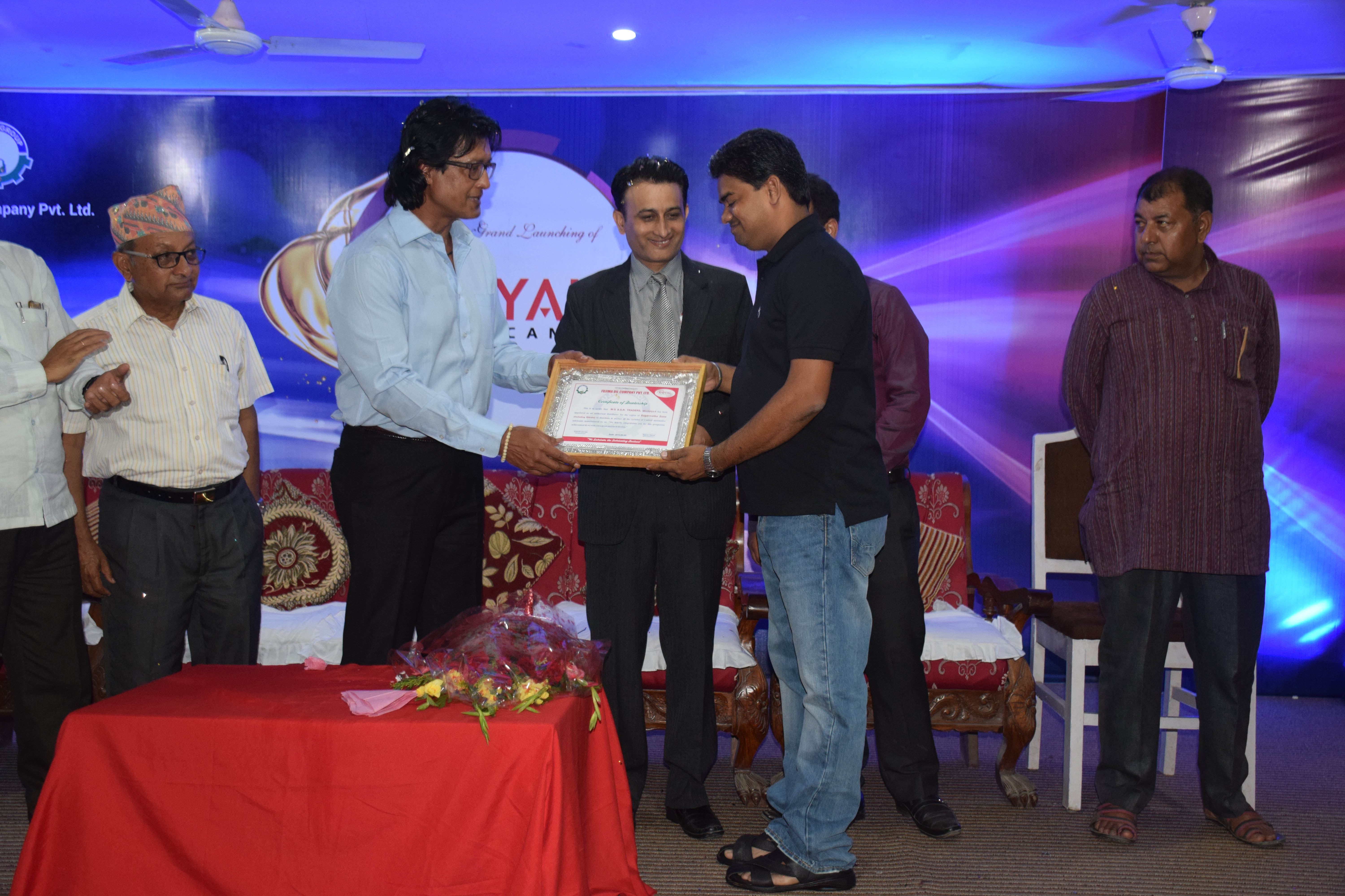 Dealer appreciation certificate distribution by Rajesh hamal Brand Ambassador of Royal lubricants
