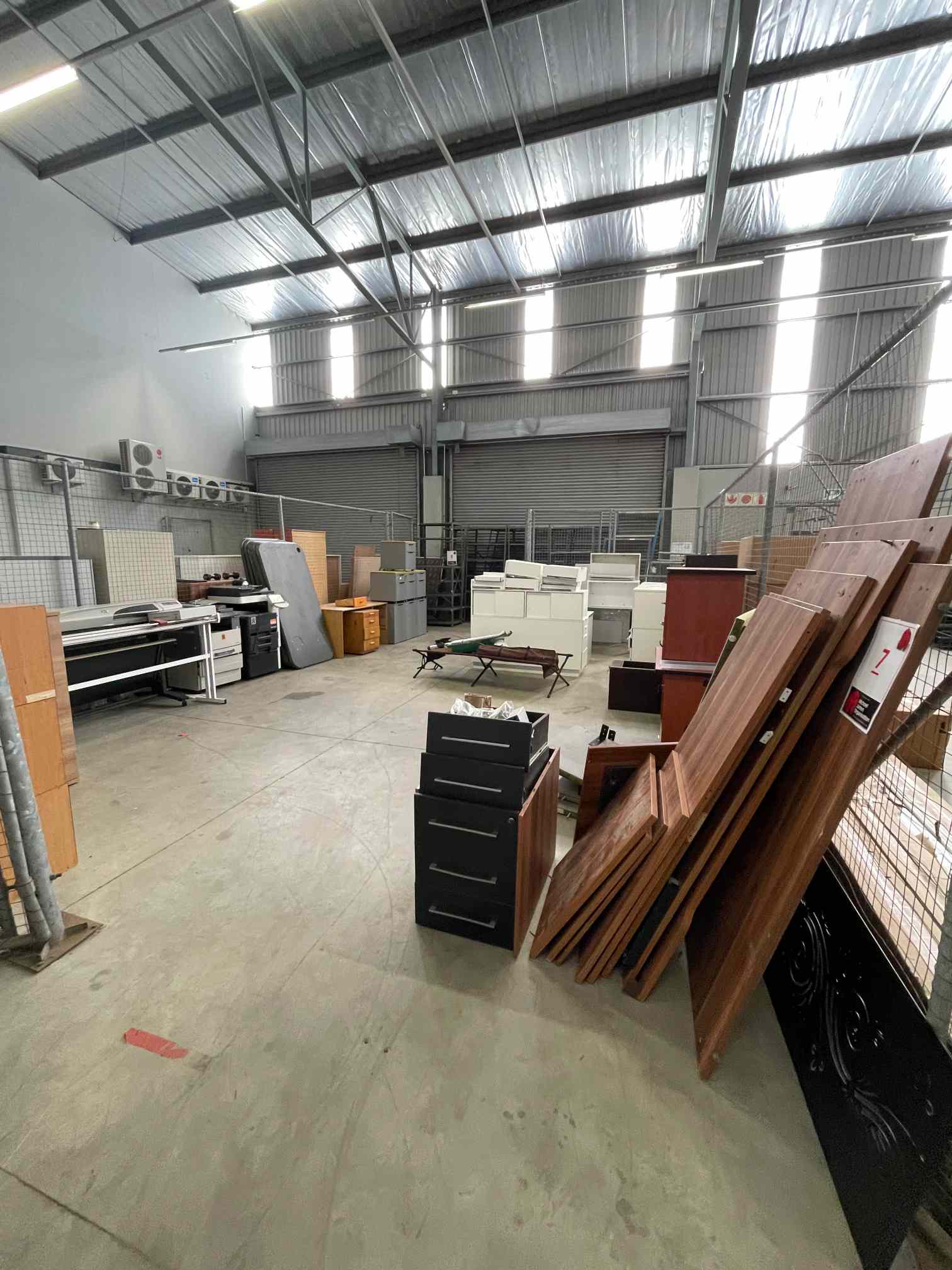 QTY OF CAGE: LARGE QTY WHITE DESKS, CREDENZA'S, PEDESTALS (DISMANTLED , 8 X GREY TABLE TOPS,CAMPING BED, CAMPING CHAIR, FISHING ROD, CHRISTMAS TREE, 2 X GUEST CHAIRS, OAK DESK, OAK PEDESTAL, 4 X PADDED TOP WHEELY PEDESTALS, 2 X ITEX B283 & B211 COPIERS, HP PRINTER, IDEAL STAND, 2 X STEEL TABLES, QTY SIDE DEVIDER PANELS, DUSTBINS, QTY X DARK WOOD PEDESTALS, CHERRY WOOD PEDESTAL  & CREDENZA, WOODEN DESK & PEDESTAL (DISMANTLED)