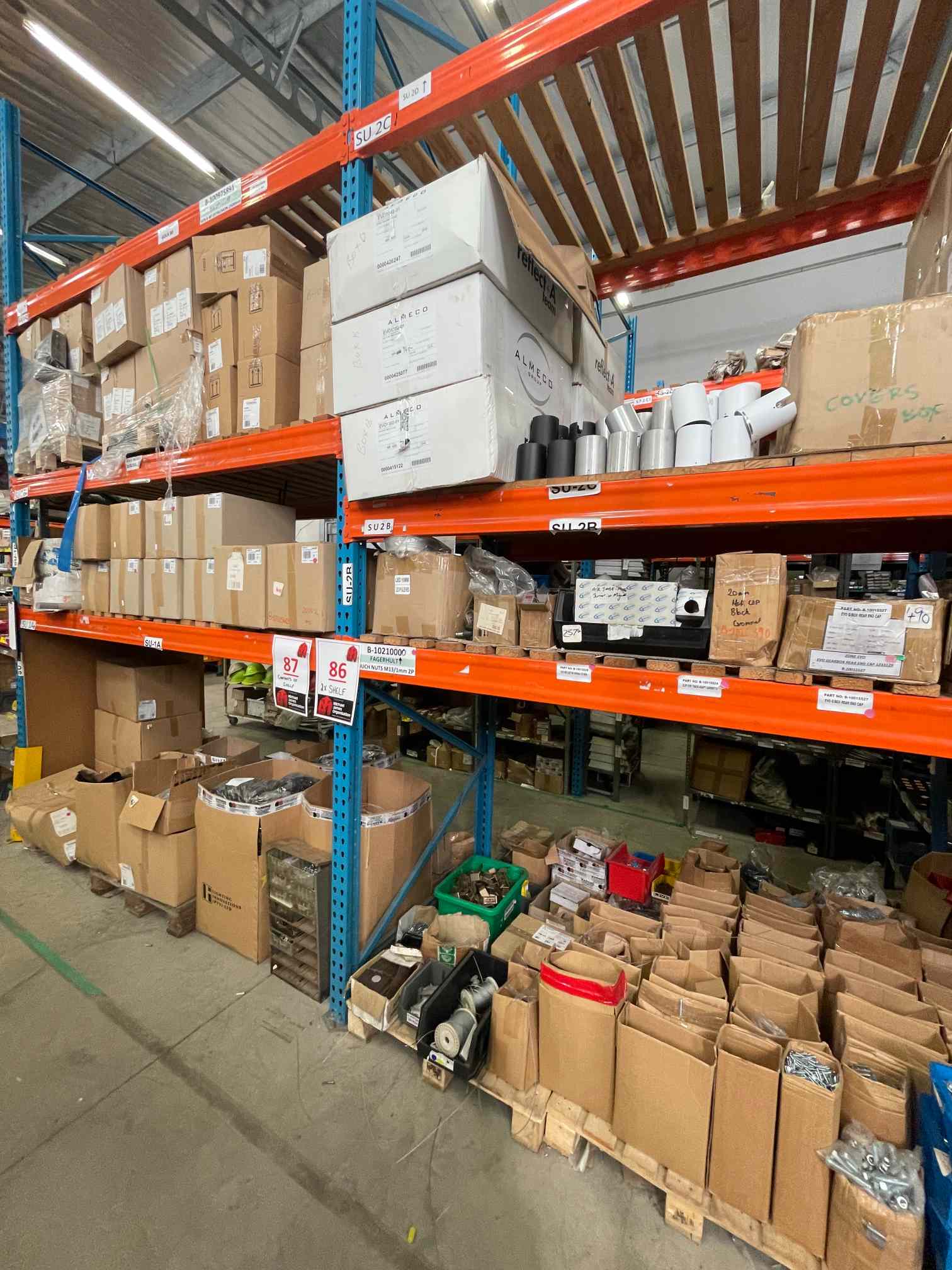 CONTENTS OF 2 SHELVES: NUTS, BOLTS, SCREWS, CLIPS, PLASTIC CONTROL COVER BOXES, LED IP SLEEVES, TERMINALS ETC