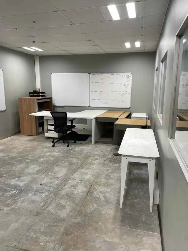 CONTENTS OF MEETING ROOM: DESK, CHAIR, 2 X PEDESTALS, SLIDING DOOR CREDENZA, 2 X WORK TABLES, FILING TRAYS ETC