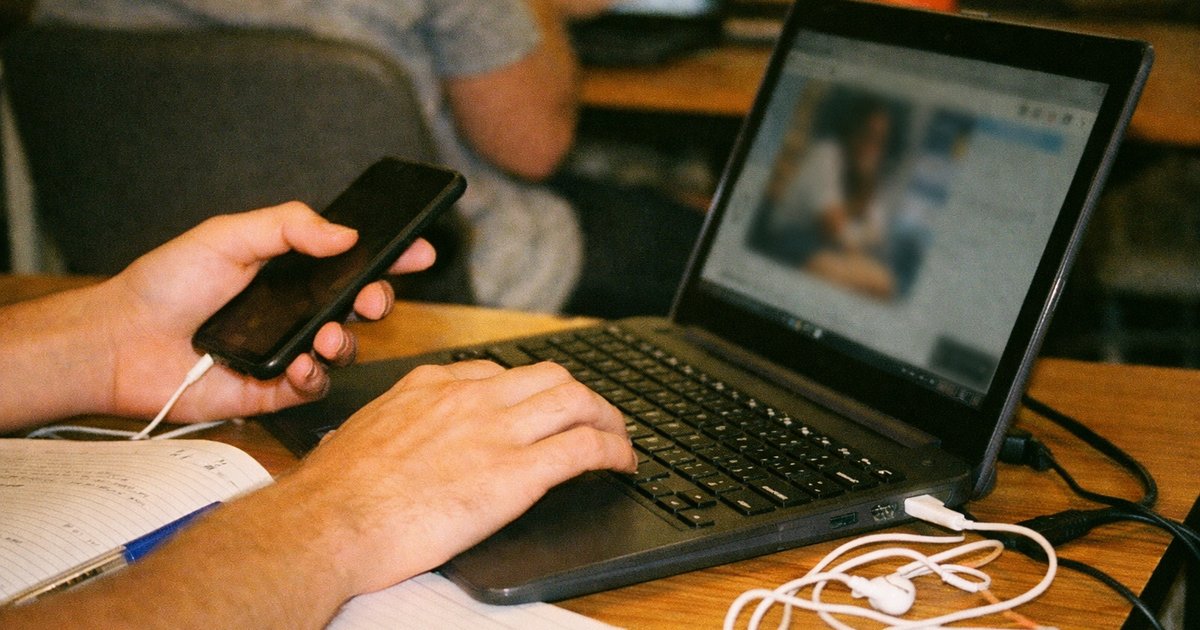 People in a tech startup environment, reflecting 90s film aesthetic, showcasing technology's negative impact on education.
