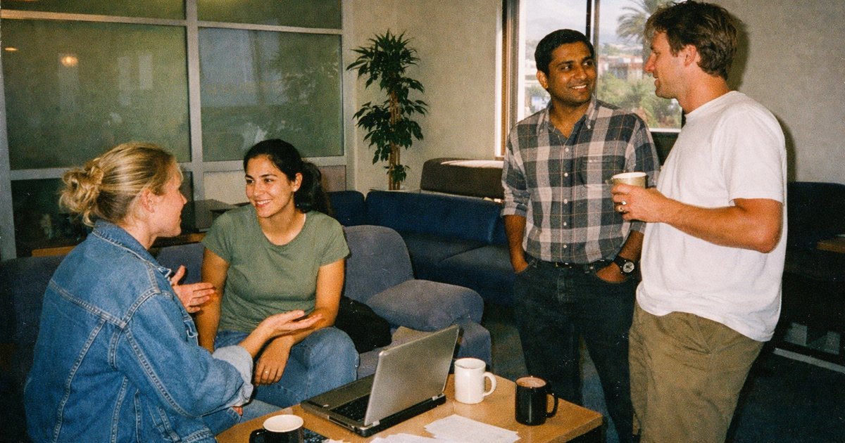 Tech entrepreneurs collaborate in a vibrant 90s film aesthetic, exploring funding routes for AI startups in 2026.