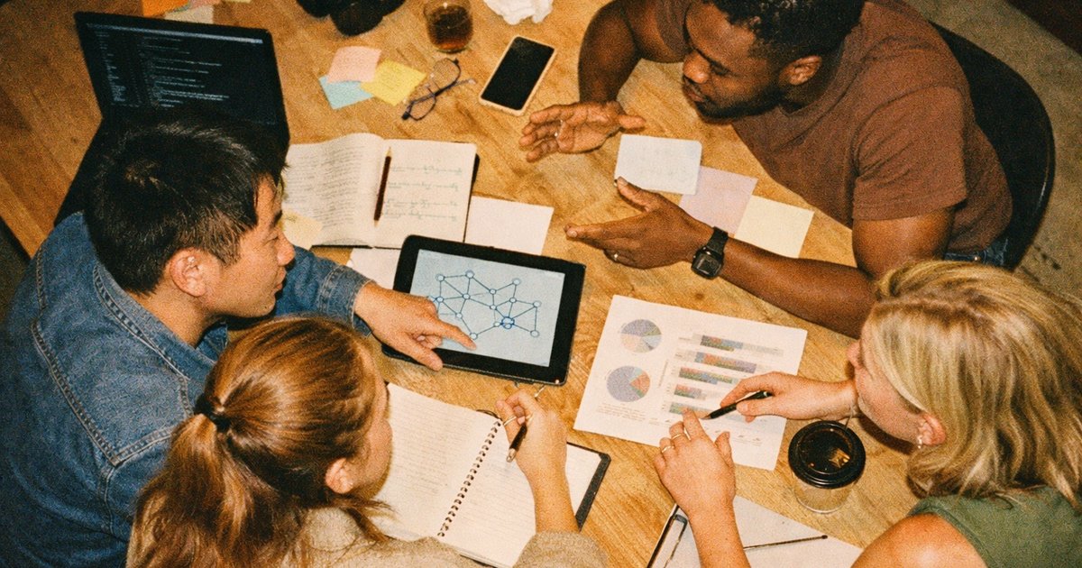 Team collaborating in a vibrant 90s tech startup, reflecting Australian demand for innovative roles.