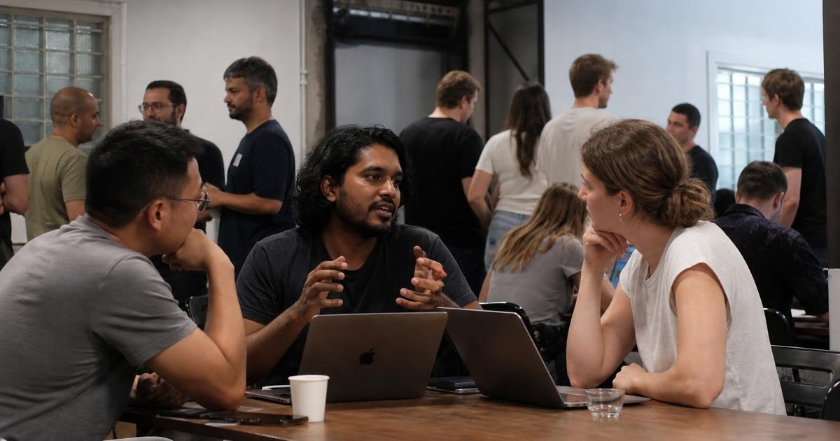 Australian startup founders and engineers collaborating at a candid AI workshop meetup