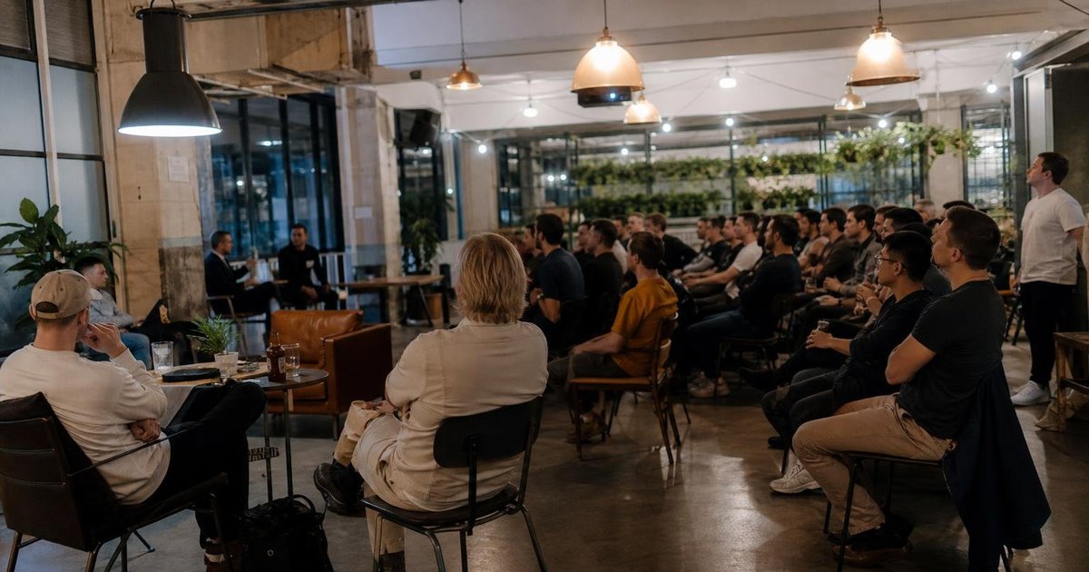 Sydney AI meetup attendees chatting after one RSVP at a casual tech networking event