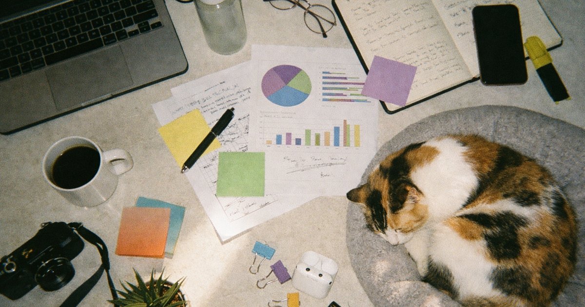 People collaborating in a tech startup setting with a nostalgic 90s film aesthetic.