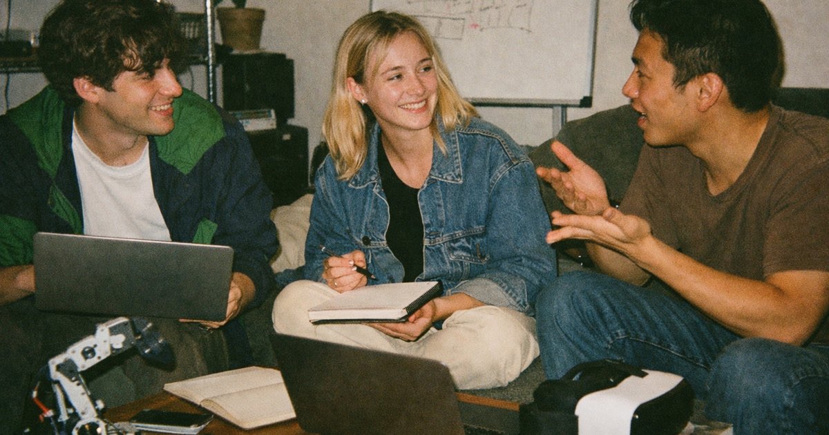 People collaborating in a vibrant tech startup environment with a nostalgic 90s film aesthetic.