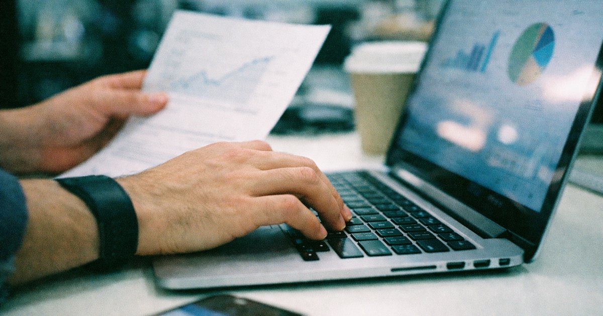 Tech-savvy team brainstorming in a 90s film aesthetic, showcasing a vibrant startup environment.