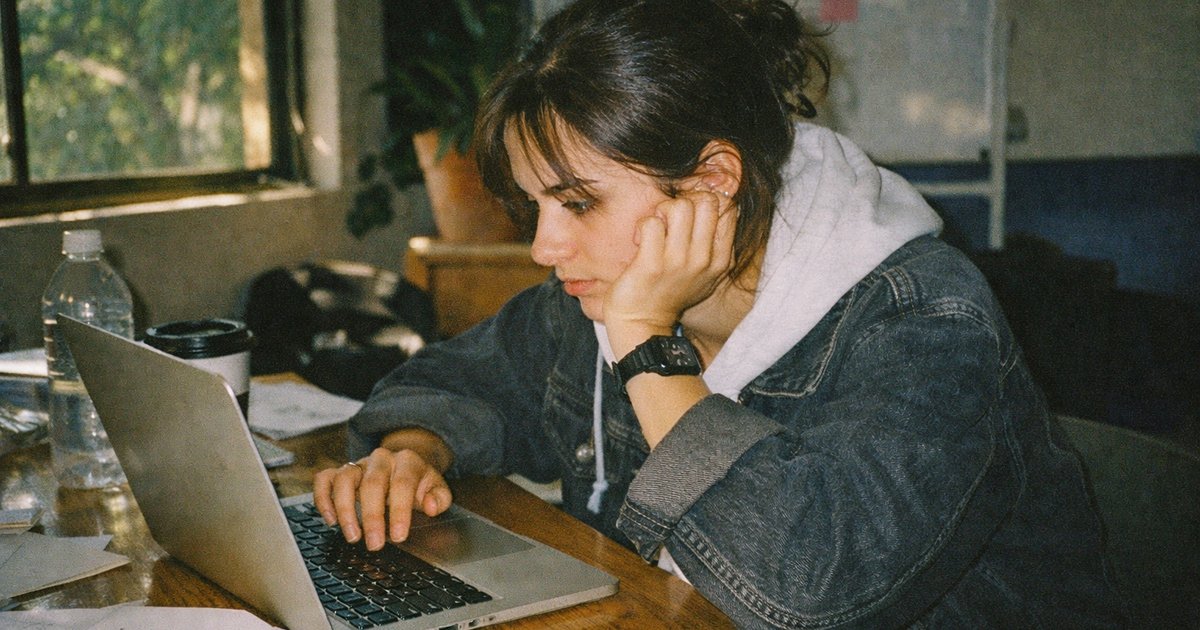 Tech-savvy team collaborating in a 90s-inspired startup setting, embodying creativity and innovation.