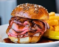 Hearty Buffalo beef on weck sandwich, a local recipe secret, beckons with savory deliciousness.