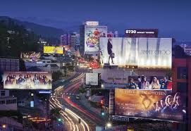 Golden LA skyline at dusk, urban buzz, captivating discovery of city truths.