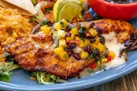 Golden Sunstone Enchilada at a Sedona table, warm Arizona light, budget travel vibe.