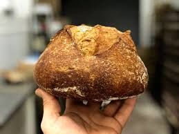 Golden sourdough crust, San Jose dining secret, warm bakery light.