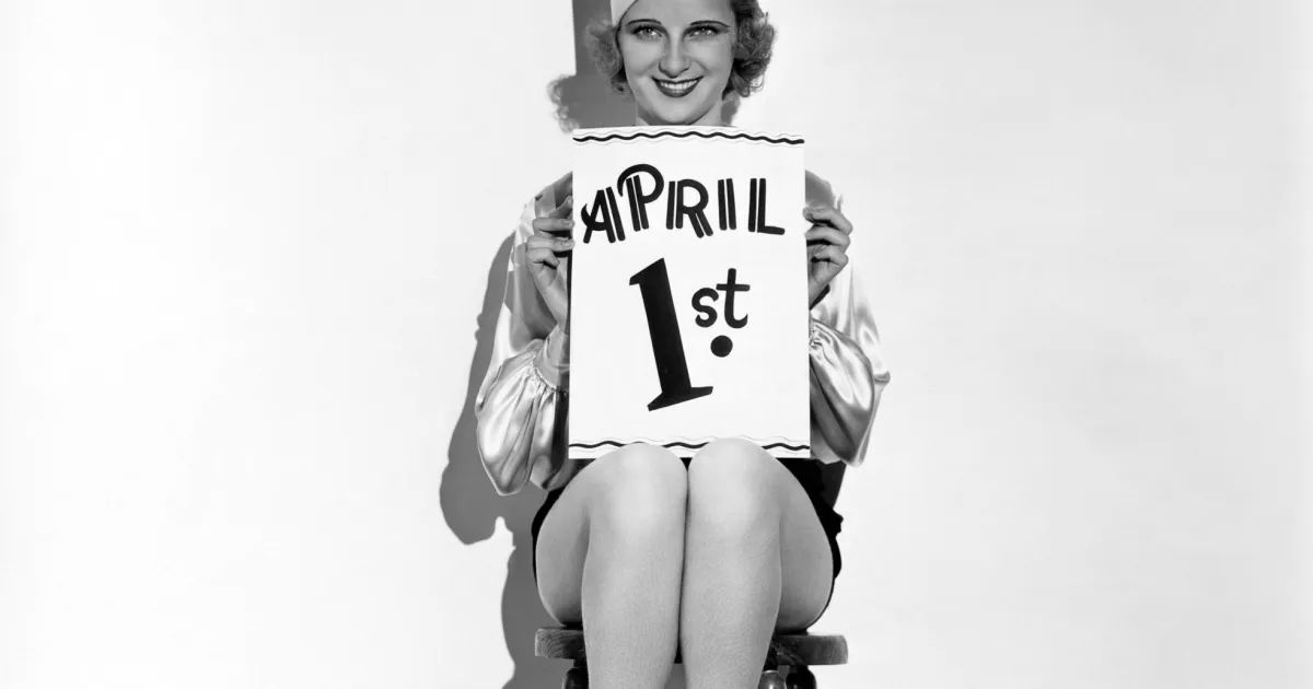 Humorous NYC street scene, vibrant energy, April Fools' prankster's surprise, beckoning discovery.