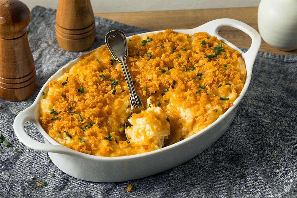 Creamy, cheesy funeral potatoes in a cozy SLC restaurant, a secret comfort food.