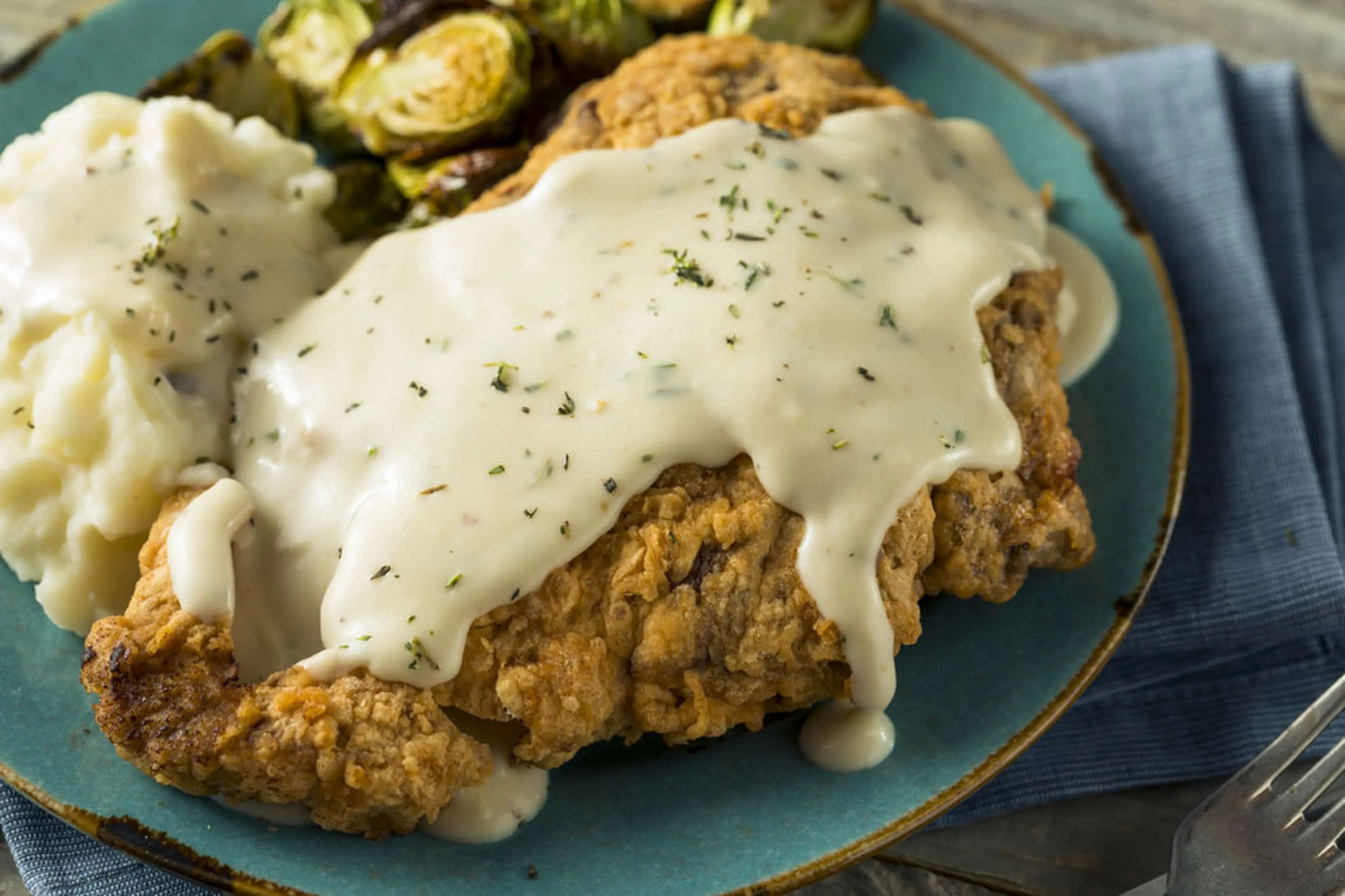 Crispy, golden chicken fried steak, Garland TX culinary gem, hearty Tex-Mex delight.
