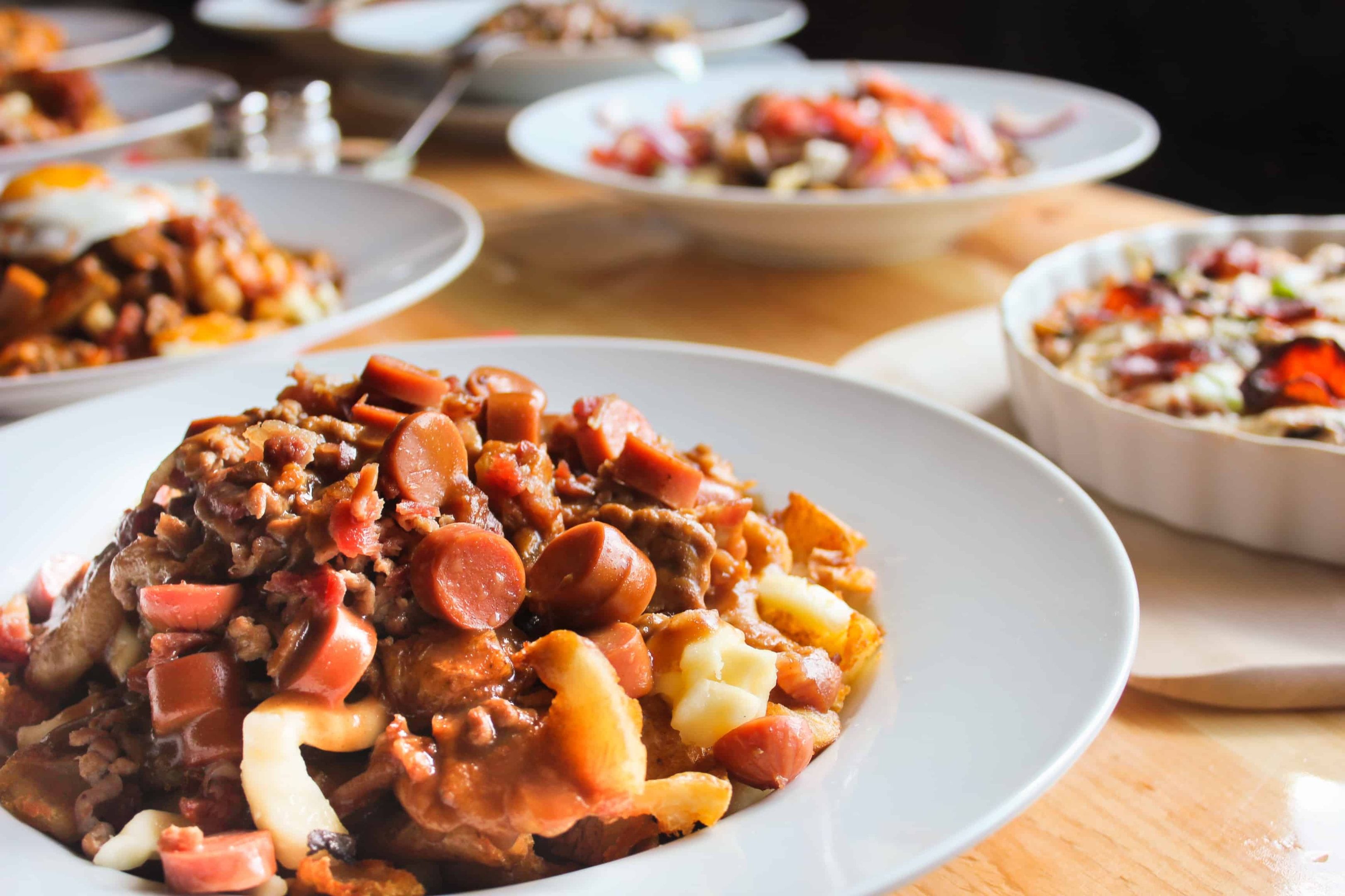 Golden poutine in cozy Quebec City bistro, evoking warmth and local culinary secrets.