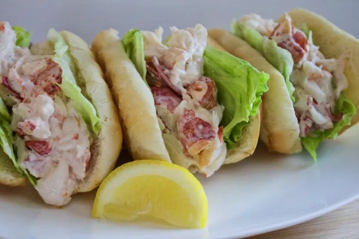 Juicy, classic Newport RI lobster roll, briny sea air, a local culinary secret revealed.