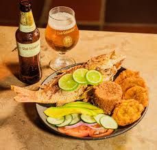 Vibrant Cartagena kitchen, golden light, aromatic arroz con coco, authentic local cuisine.