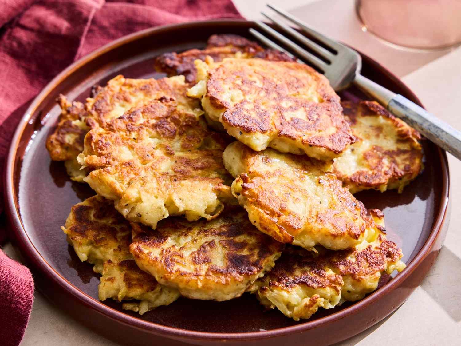 Golden boxty on rustic plate, warm lighting, inviting Limerick kitchen, local culinary joy.