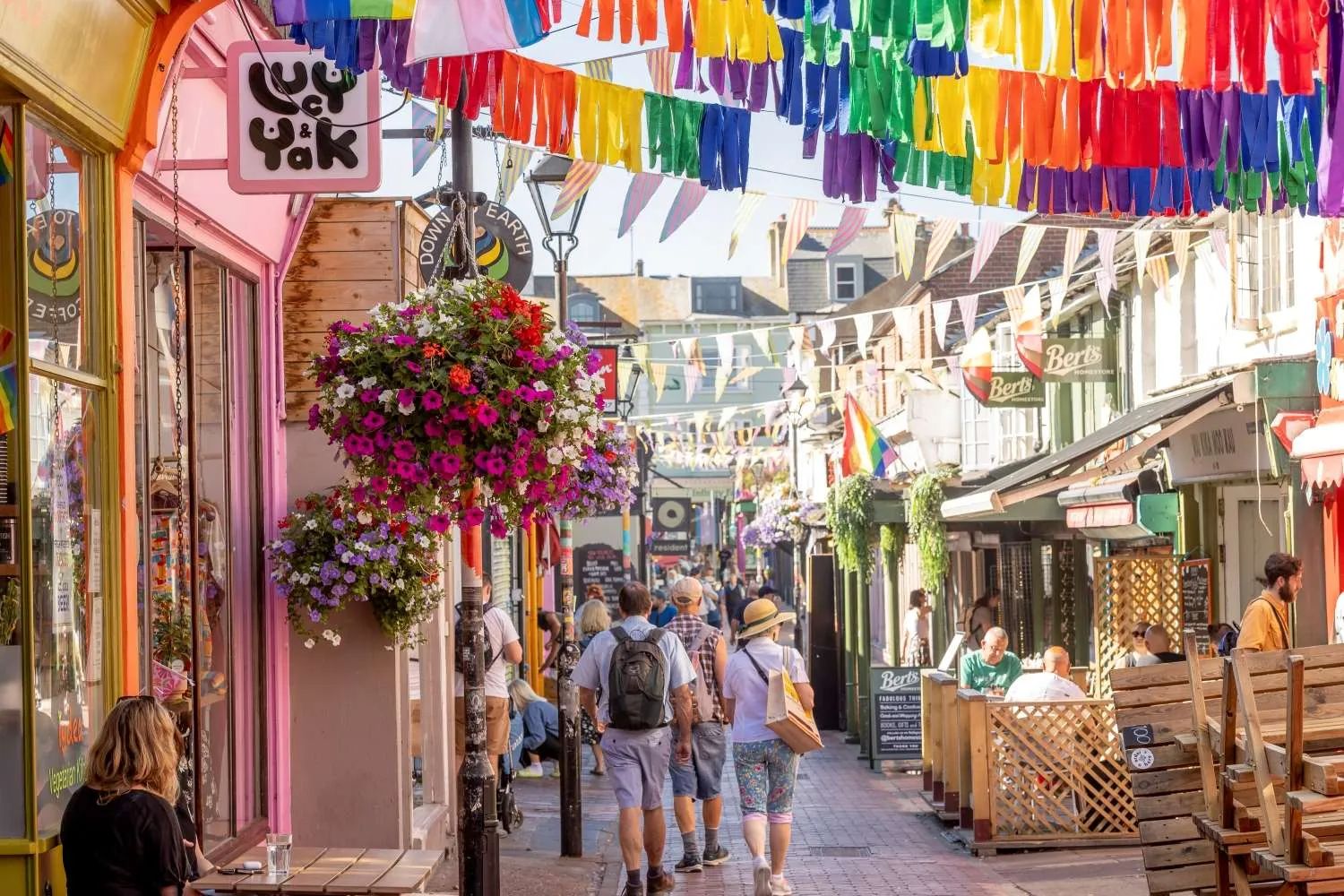 Vibrant Brighton pier at sunset, lively coastal energy contrasting with implied urban grit.