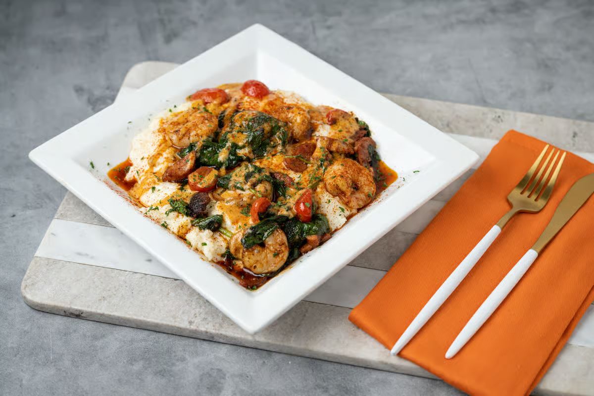 Jacksonville FL's vibrant culinary scene: steaming shrimp & grits, golden hour glow, local flavor.