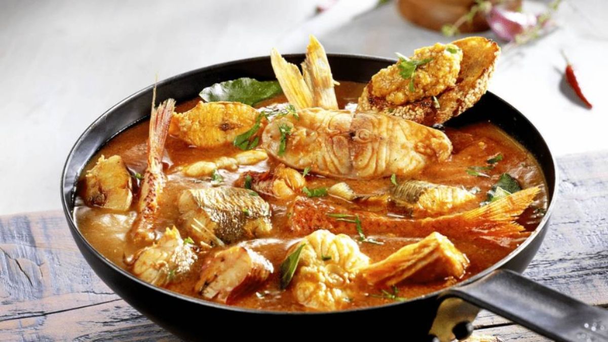 Rich, aromatic Marseille bouillabaisse steaming in a rustic bowl, evoking Provençal warmth and culinary adventure.
