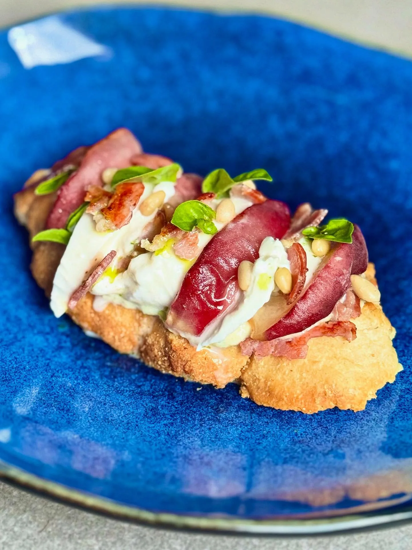 Honey-roasted peach, Burrata, and crispy bacon Ciabatta toast