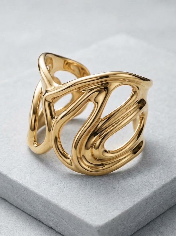 Abstract Gold Statement Ring on Stone Plinth
