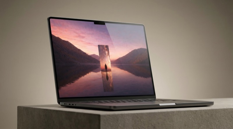 Laptop on concrete pedestal with scenic wallpaper